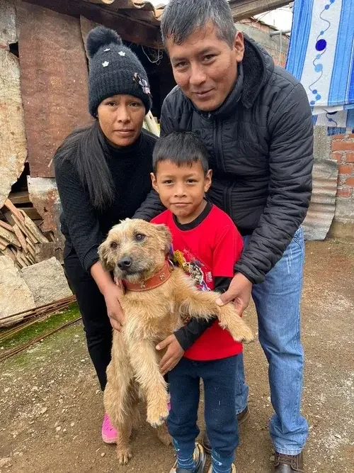 Family holding a rescue dog