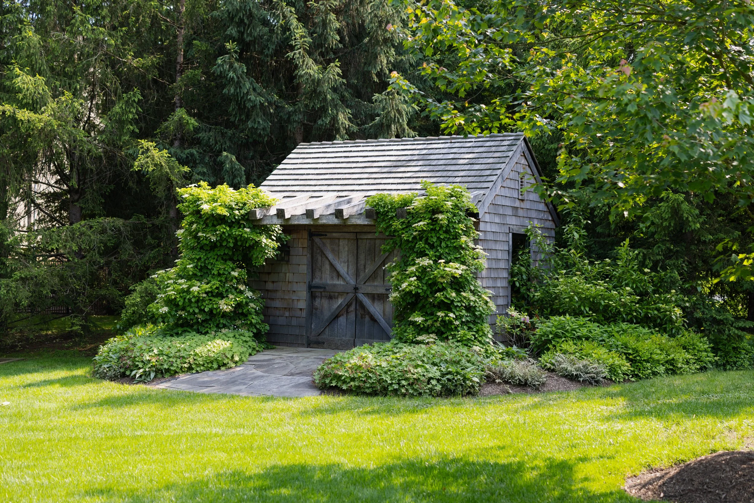 A Garden Shed Worth Stopping For: How Roots Makes Structures Feel Like Part of the Landscape