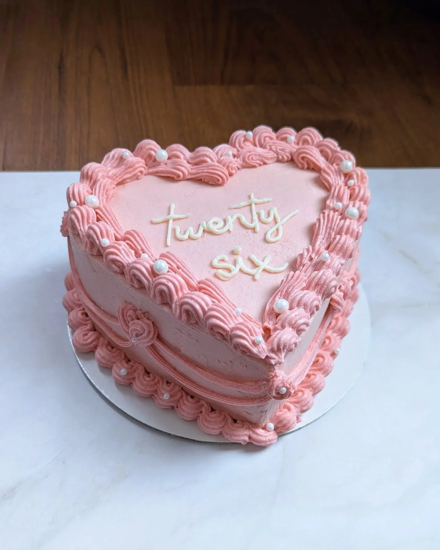 Even though this is the third vintage heart cake I've made, I still love this trend and love making these.

This one was commissioned by my friend for her little sister's birthday. It's 3 layers of matcha sponge cake filled with homemade strawberry j