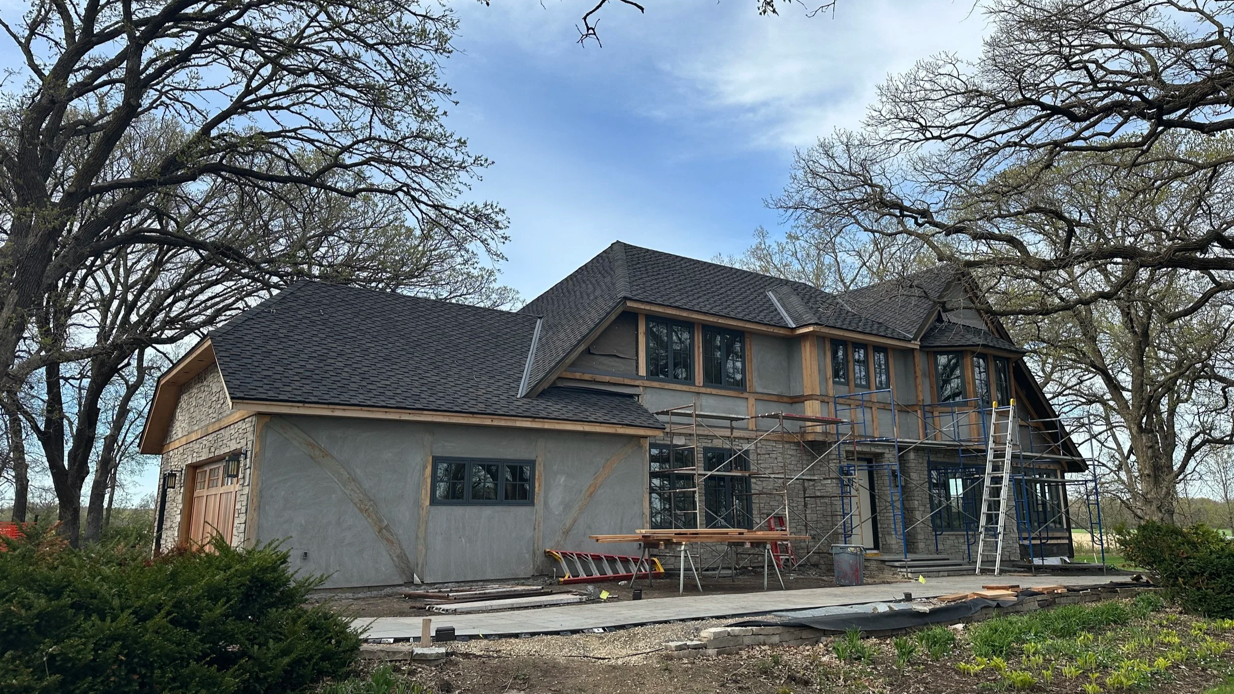 In Process exterior photo of 1970s Tudor Revival Renovation