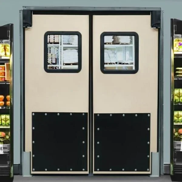 Double sliding doors with small windows at a grocery store entrance.