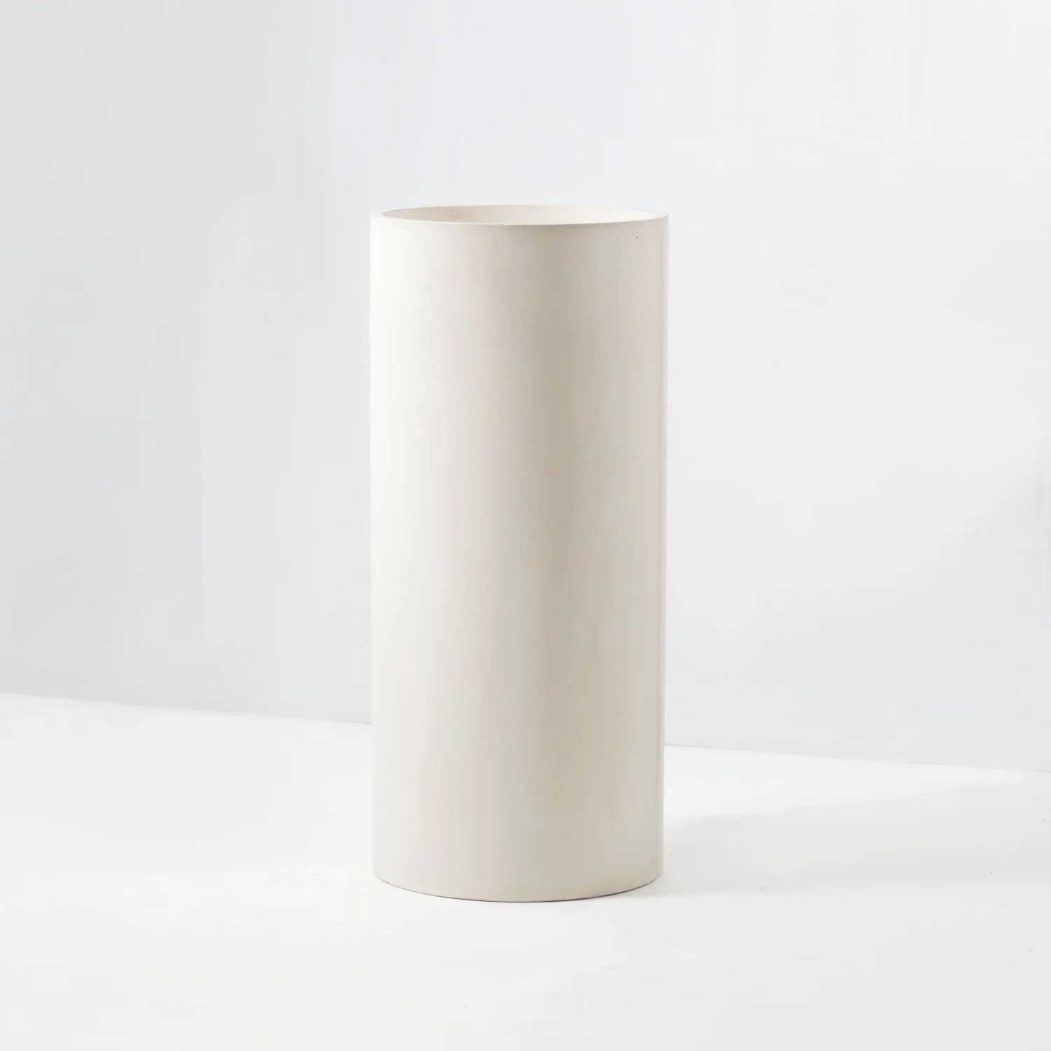 Integrated pedestal concrete basin vanity for a residential bathroom