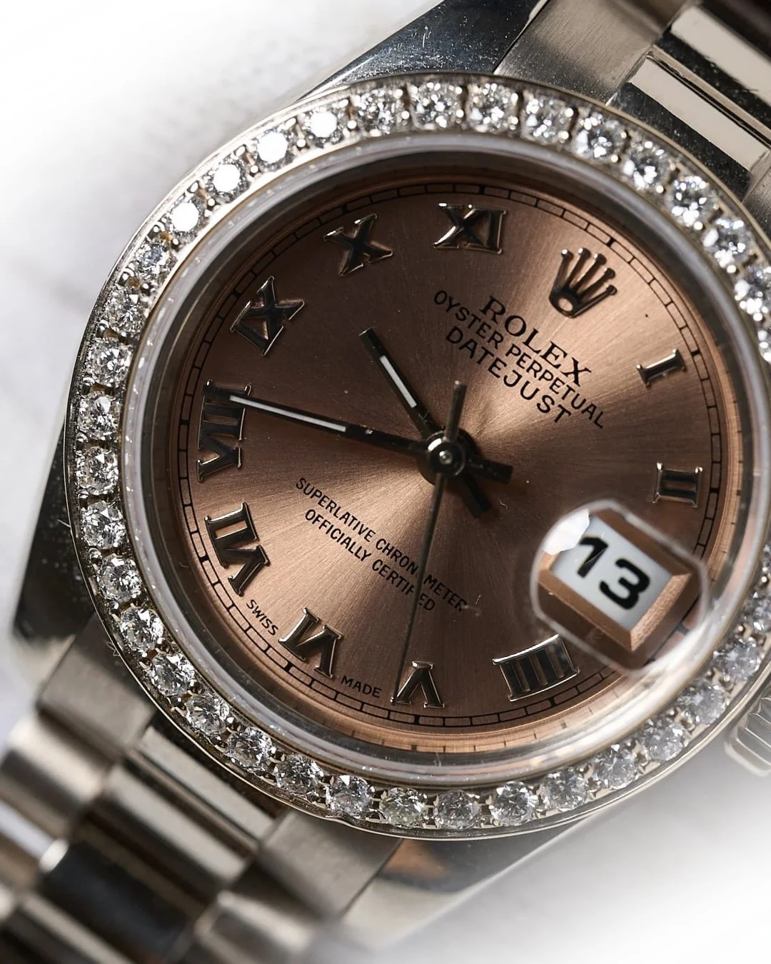 Timeless elegance in solid gold. ✨

The Rolex Datejust 26mm Ref. 179179 features a rare salmon sunburst dial, diamond bezel, and iconic President bracelet crafted in 18K white gold. This luxury ladies Rolex blends classic design with refined brillian