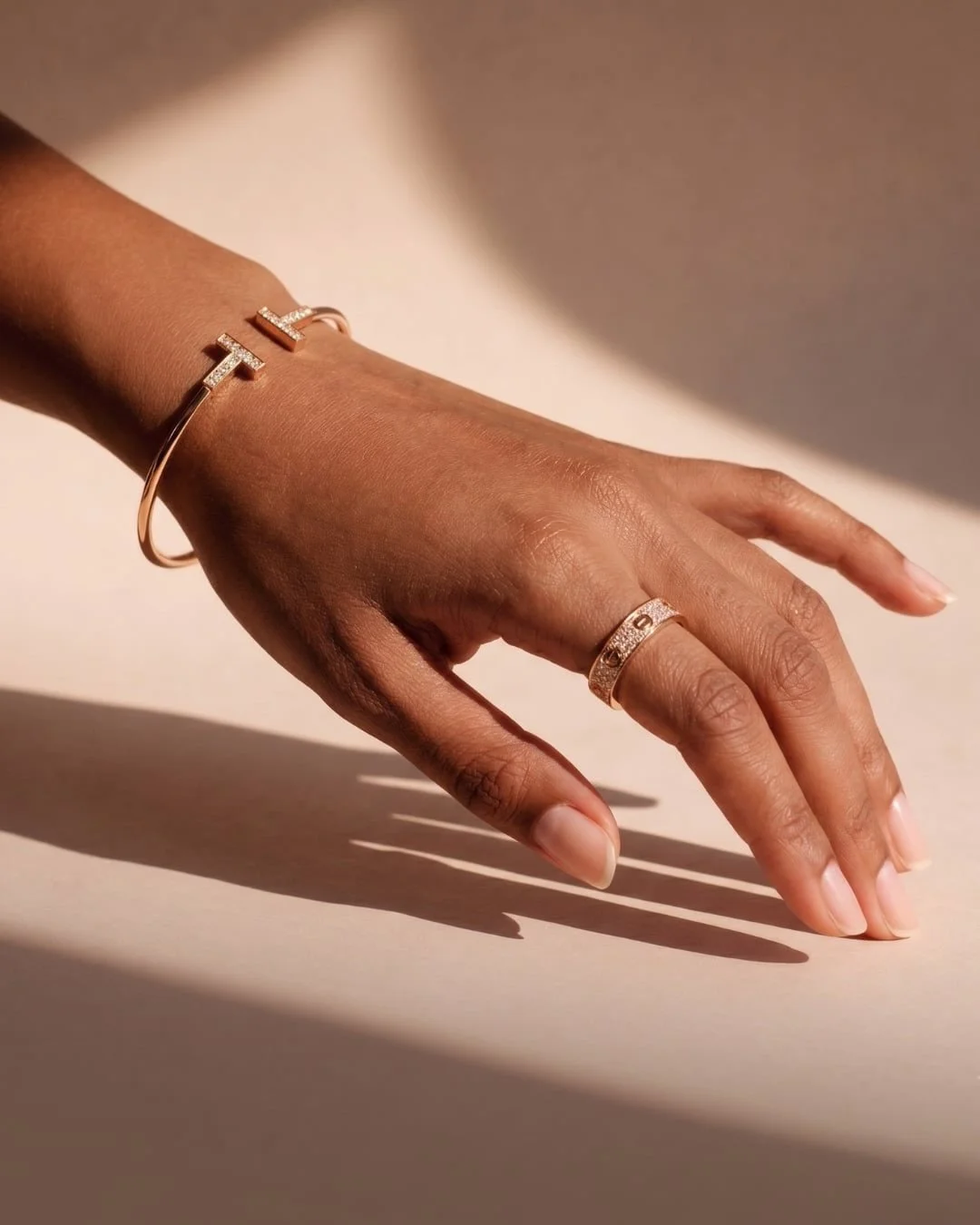 Elegance, redefined in every detail. ✨

Channel her vibe:

The Tiffany &amp; Co. T Wire Bracelet in 18K rose gold with diamonds pairs effortlessly with the Cartier Love Ring 3-row pav&eacute; diamond band&mdash;two iconic pieces that embody timeless 