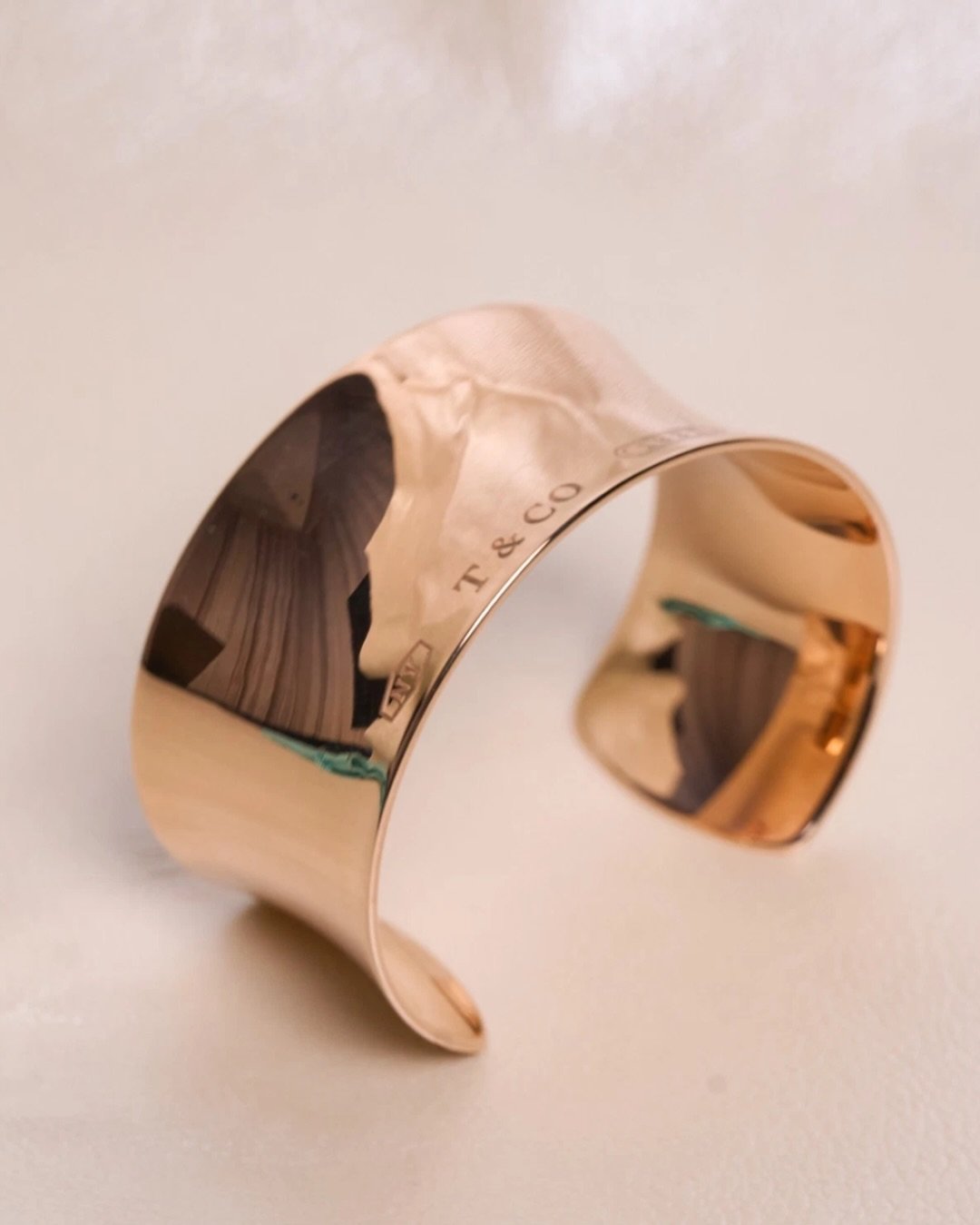 This vintage Tiffany &amp; Co. 1837 Rubedo Open Cuff is a study in modern luxury&mdash;sculptural, fluid, and effortlessly bold. Crafted in Tiffany&rsquo;s signature Rubedo metal, its warm rose glow and mirror-polished finish catch the light with eve