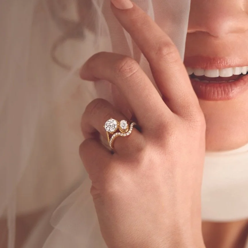 two stone toi et moi engagement ring in white gold with oval and round diamonds