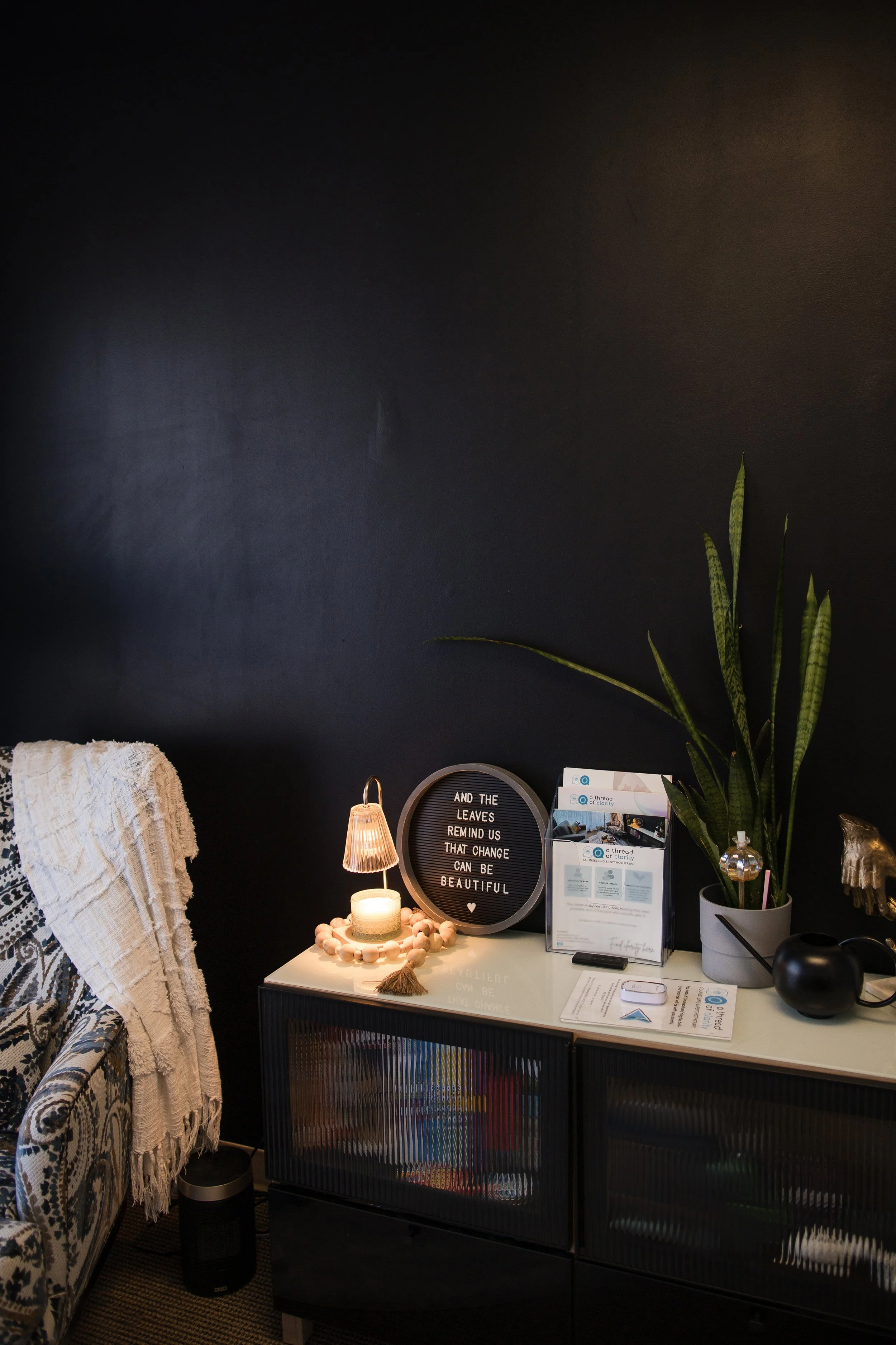 A grounded, calming therapy space at A Thread of Clarity in Edmonton designed to support trauma-informed and personalized mental health care.