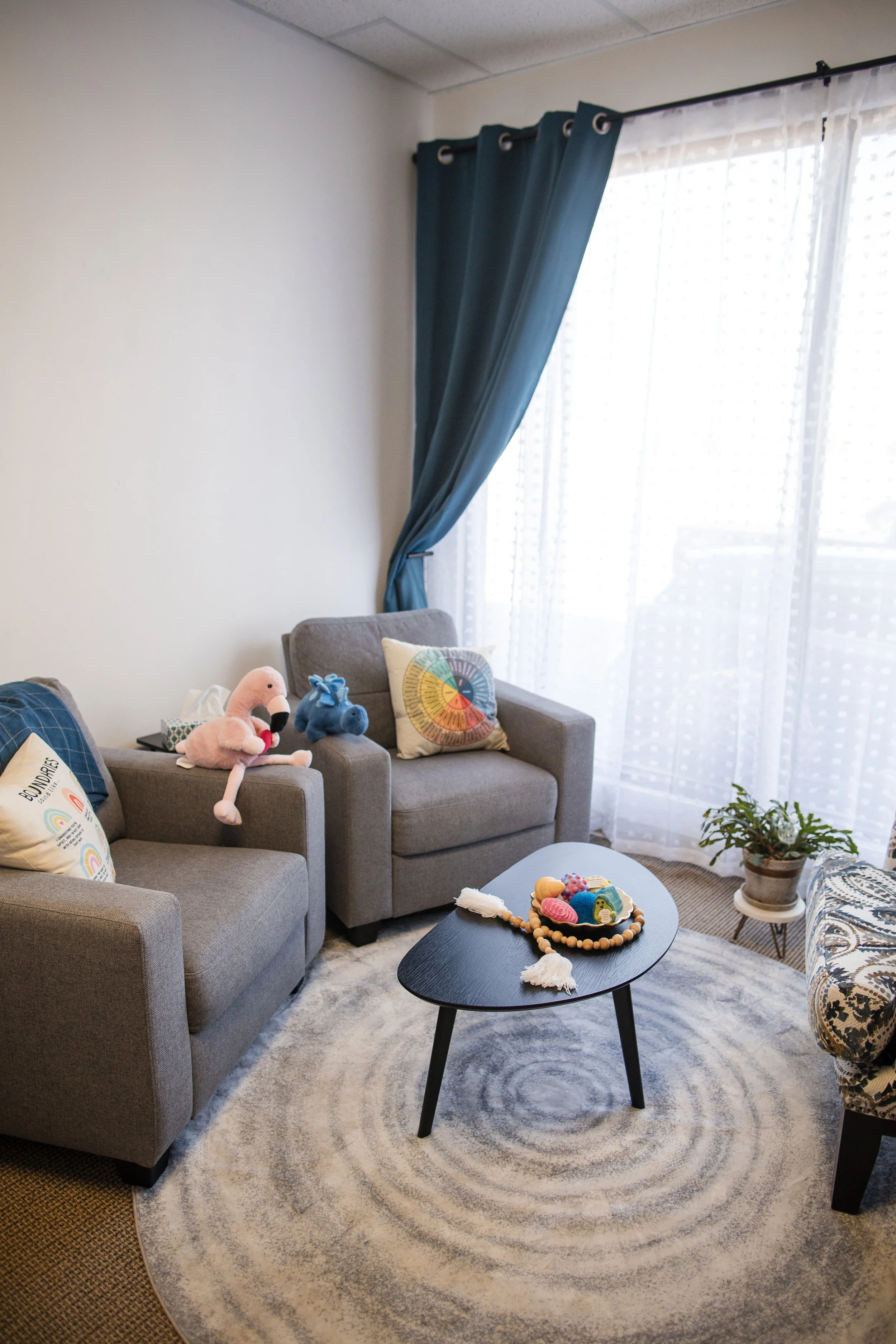 A cozy therapy office at A Thread of Clarity in Edmonton, Alberta, designed to feel calm, welcoming, and safe for in-person counselling sessions.