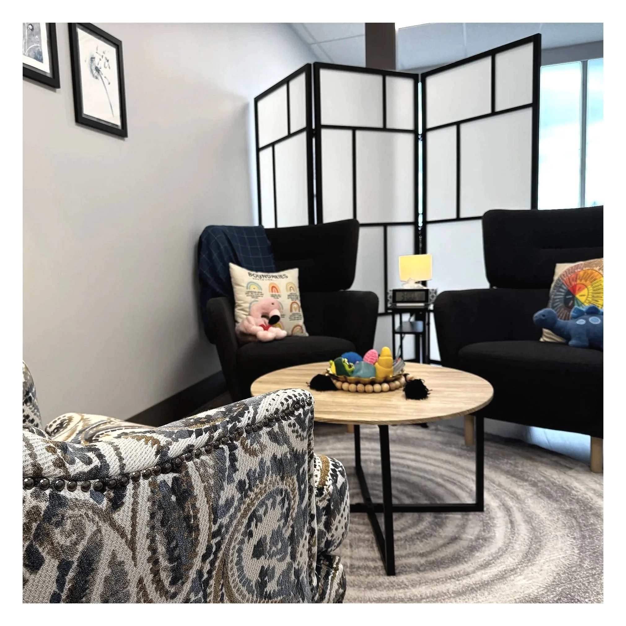 Bright and welcoming counselling office at A Thread of Clarity in West Edmonton featuring cozy seating, calming decor, and a comfortable therapy space designed to help clients feel safe, supported, and at ease during in-person counselling sessions.
