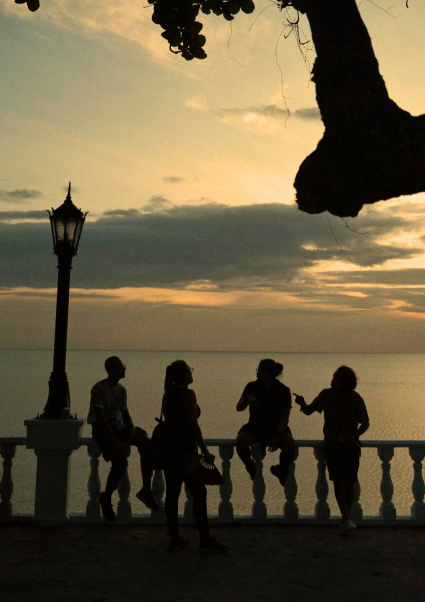 Travelers gathered by Panama Bay at sunset during a Paradox Experience tour.
