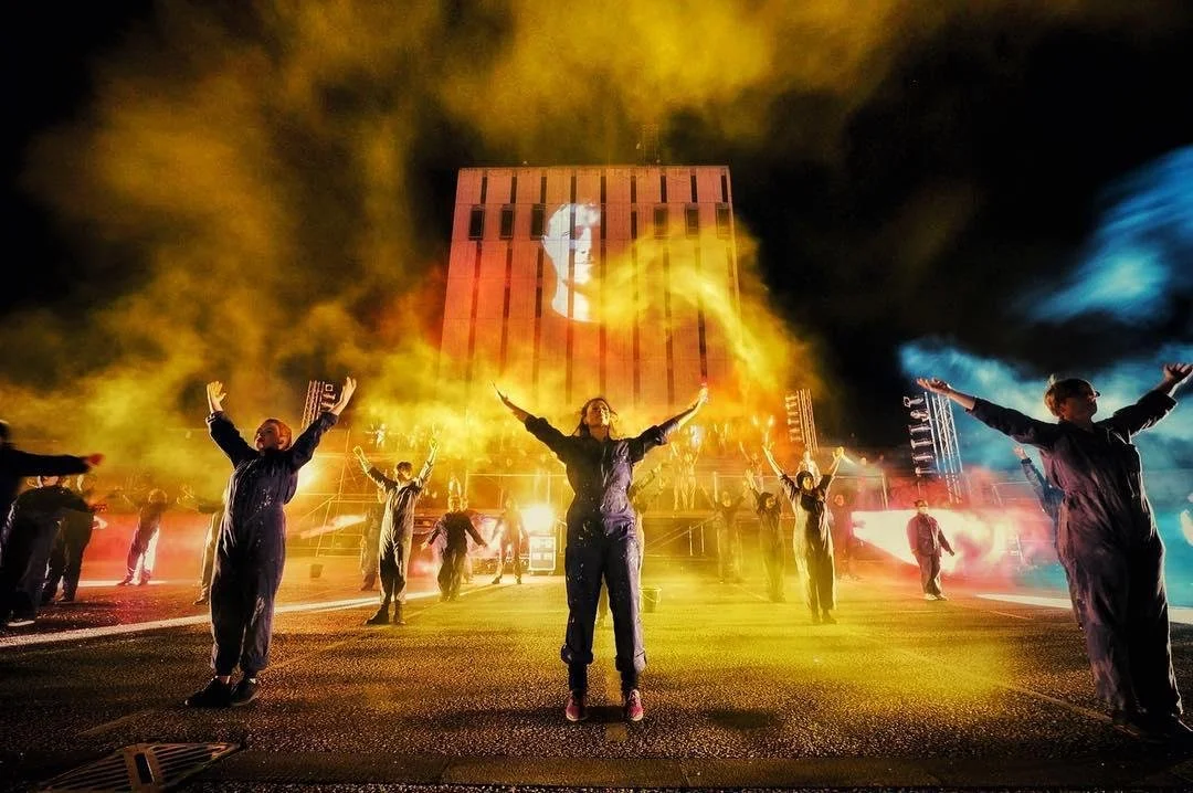 People throwing coloured dust in the air