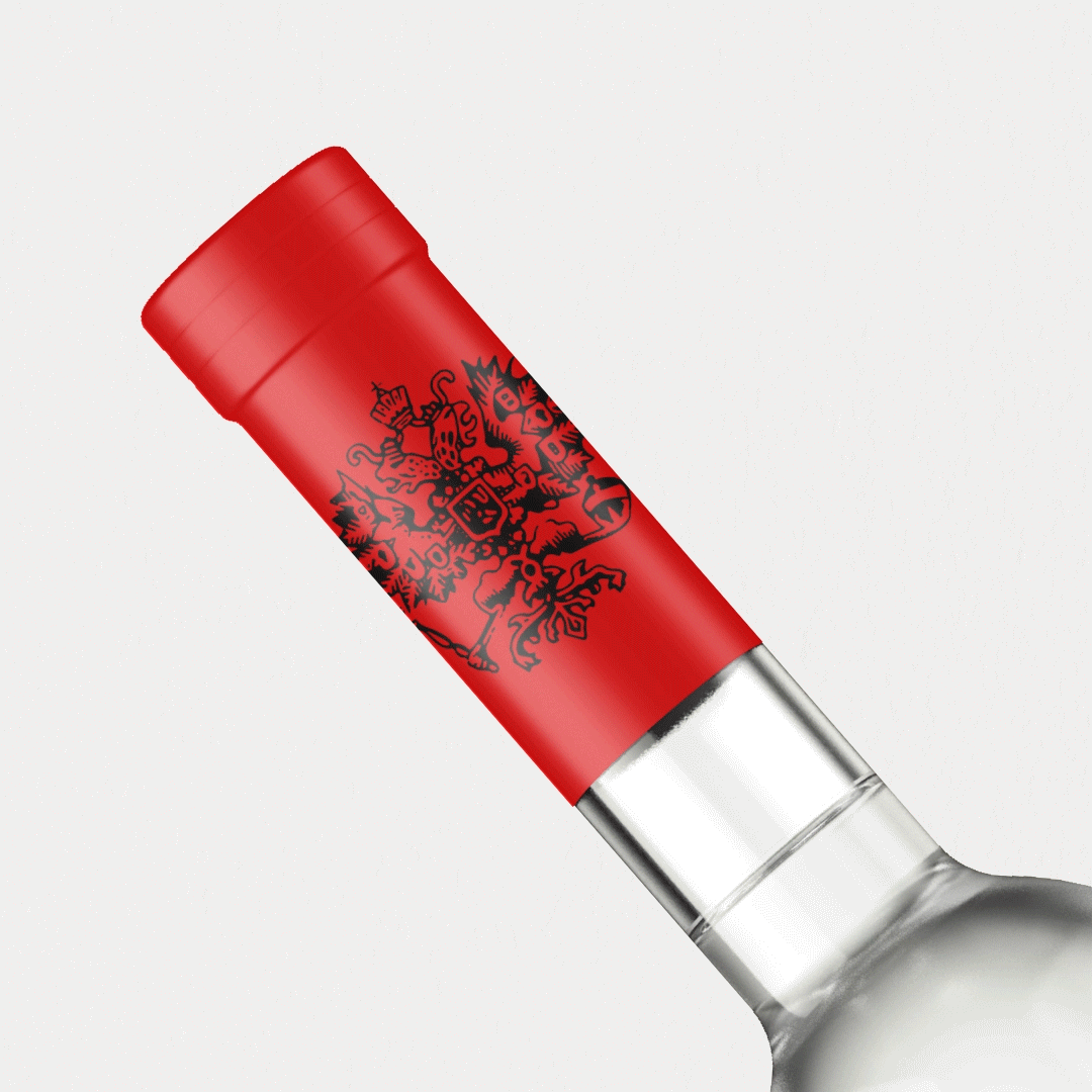 Rotating Wolfschmidt Kummel cap label, designed by Bolter Design