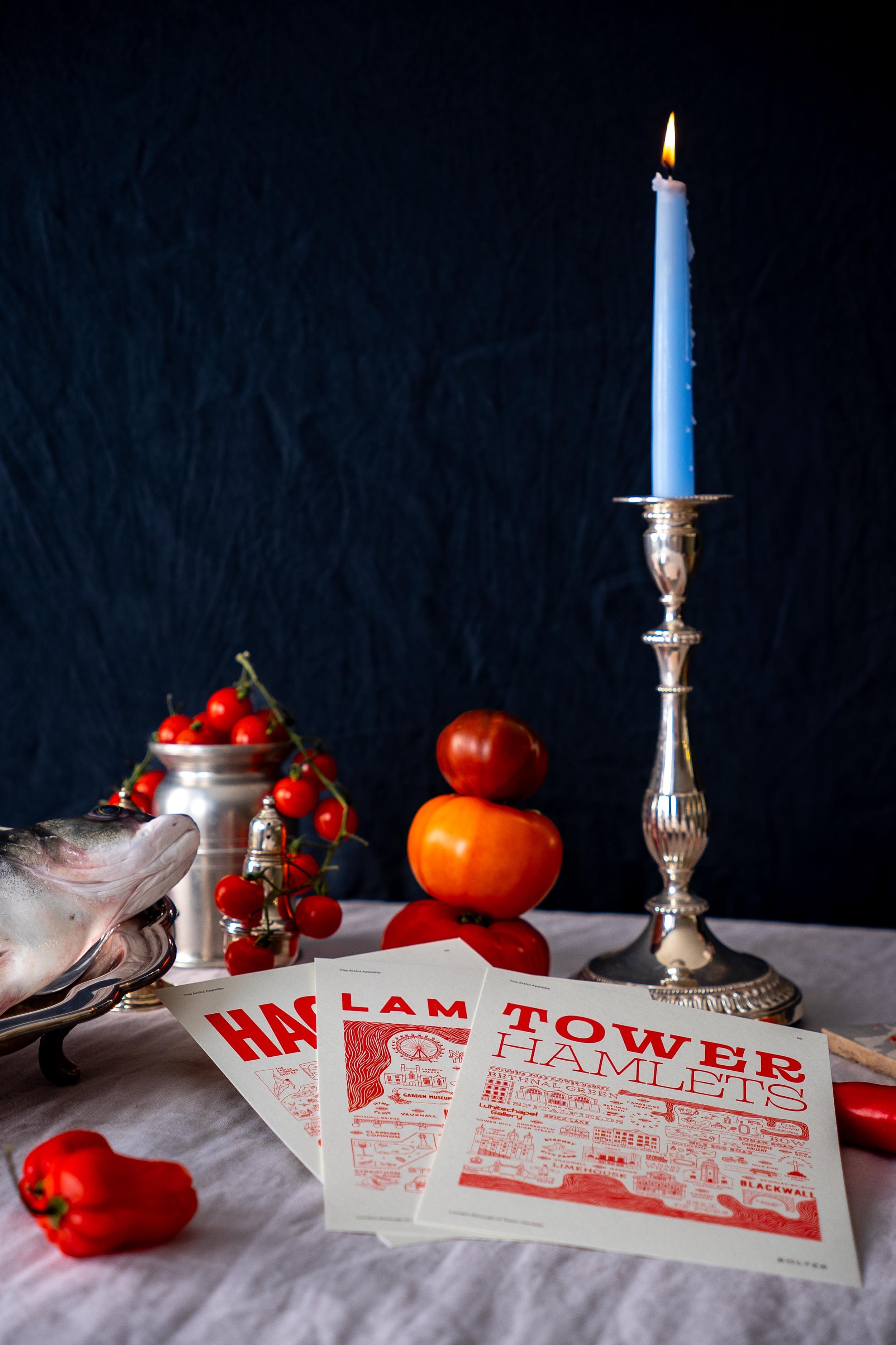 Bolter Design Artful Appetite restaurant cards with a blue candle, silverware, tomatoes, and a fish