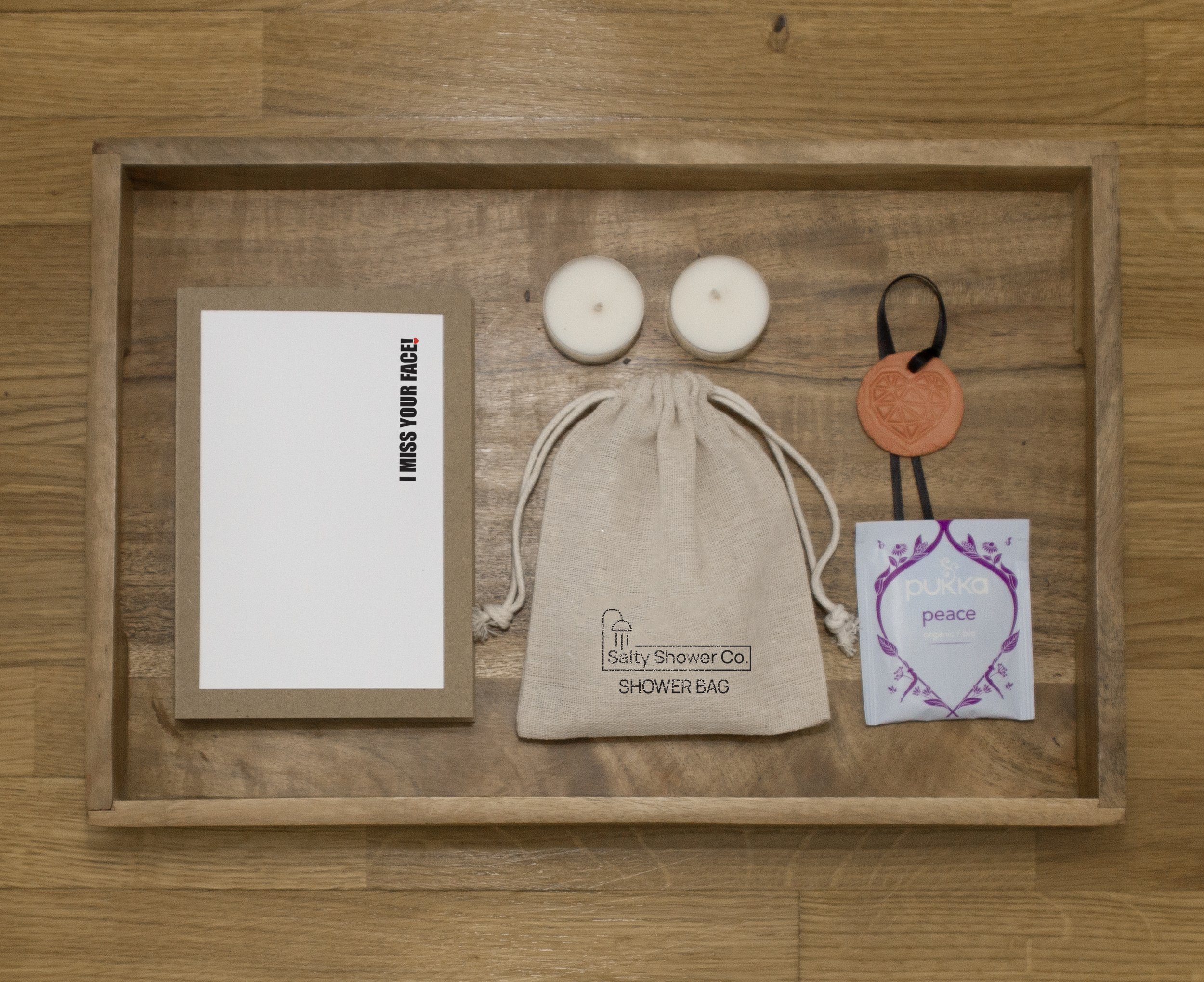 Pack contains: Salty Note, Shower Salts. Shower Bag, two scented candles, Calming Tea bag.