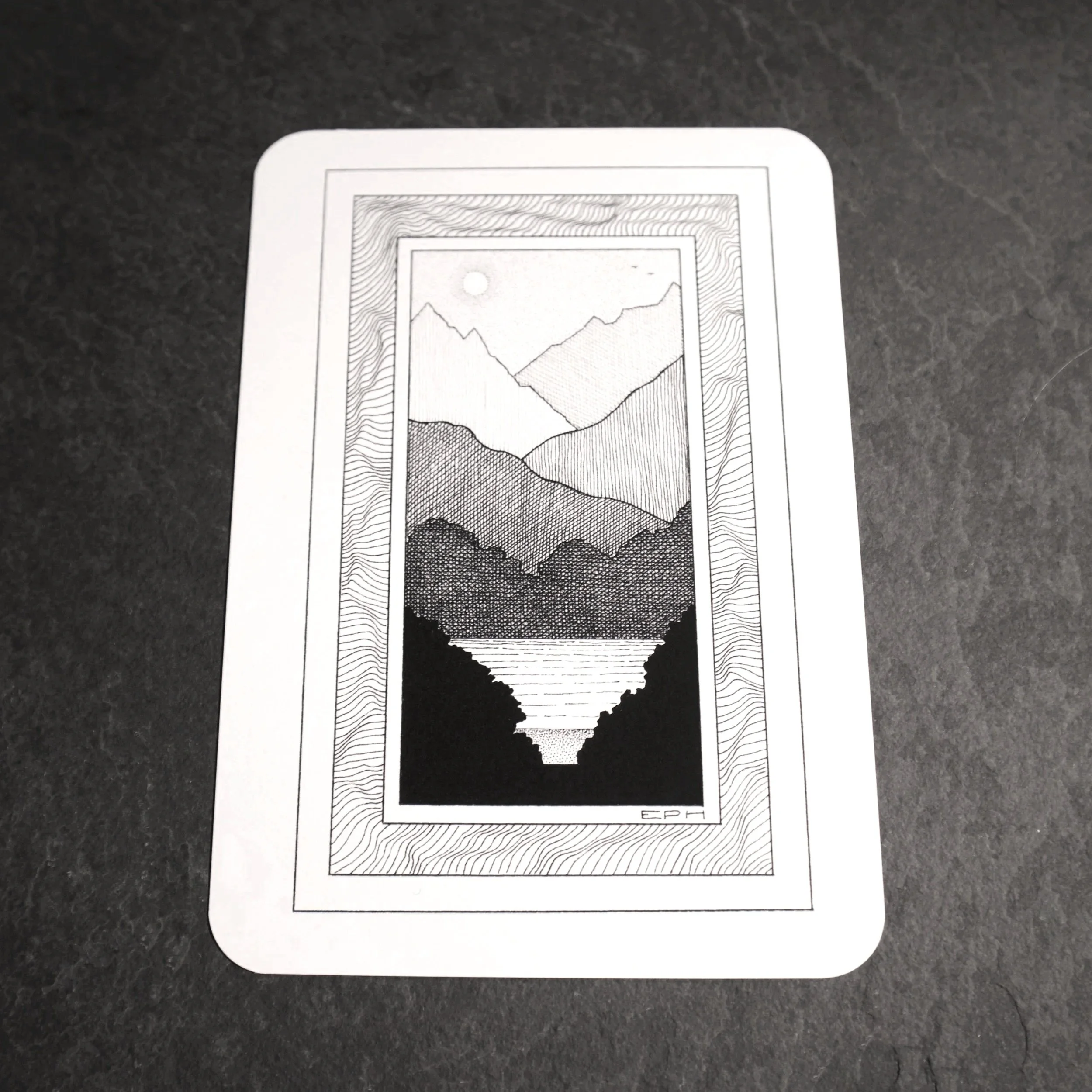 My dad's doodle 1. An intricate black and white illustration of an imagined landscape looking towards a lake, set in an abstract frame - Salty Note