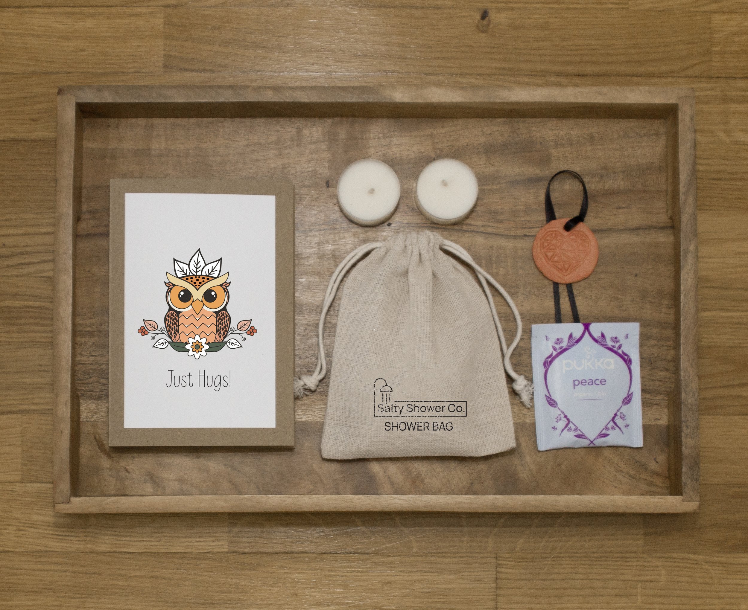 Pack contains: Salty Note, Shower Salts. Shower Bag, two scented candles, Calming Tea bag.