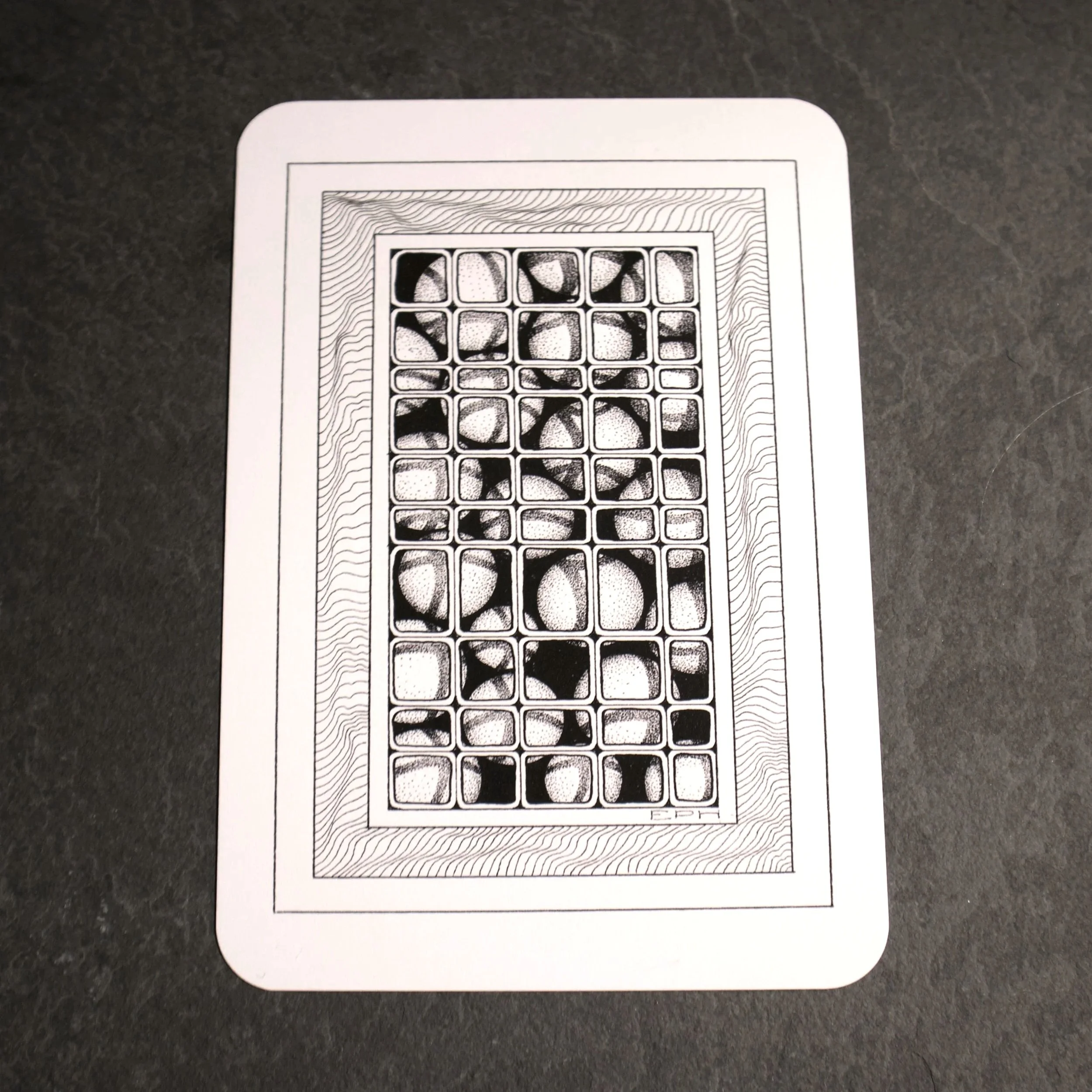 My dad's doodle 5. An intricate black and white pen illustration of 3-dimensional spheres under a grid sat in an abstract frame - Salty Note
