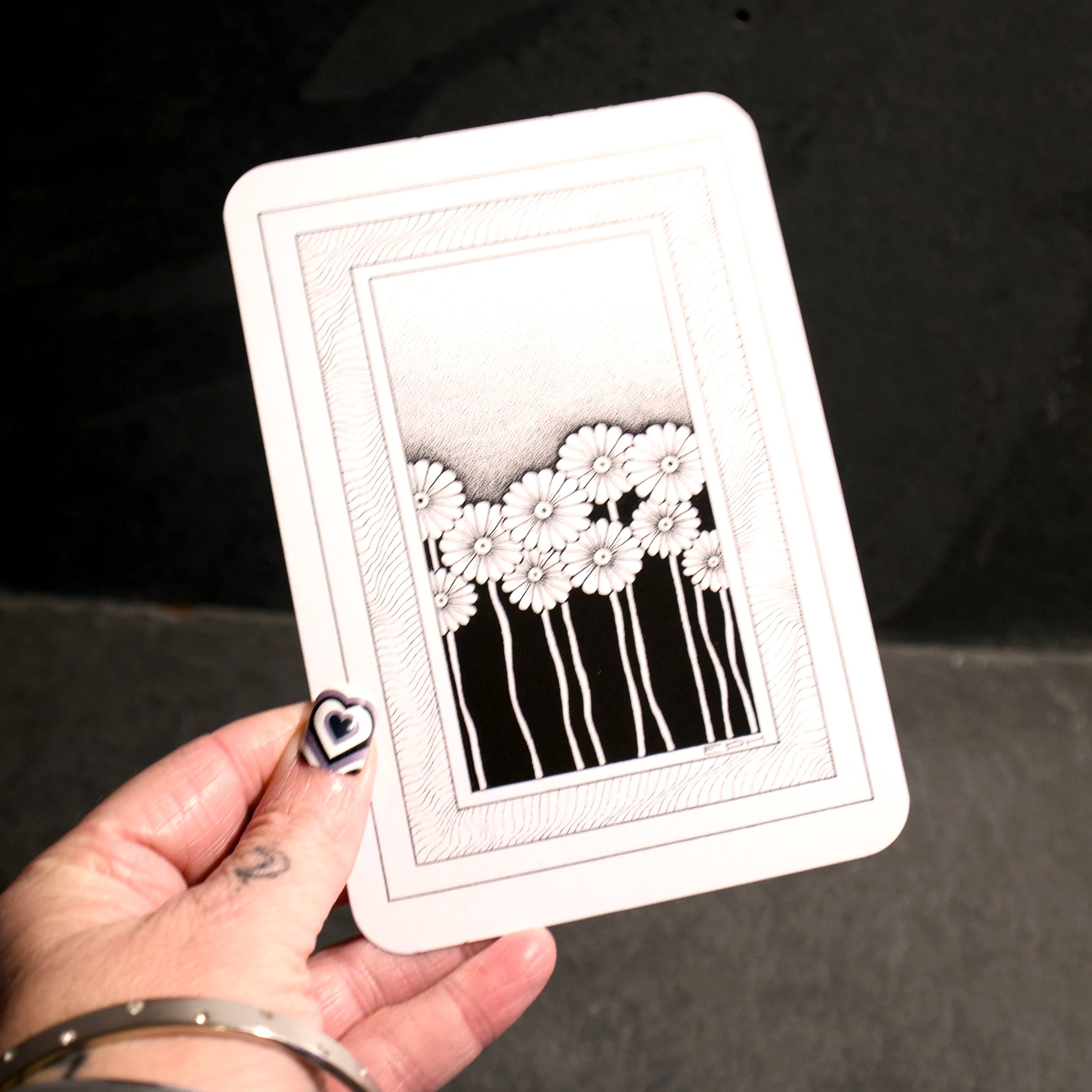My dad's doodle 5. An intricate black and white illustration of a line of daisies sat in an abstract frame - Salty Note