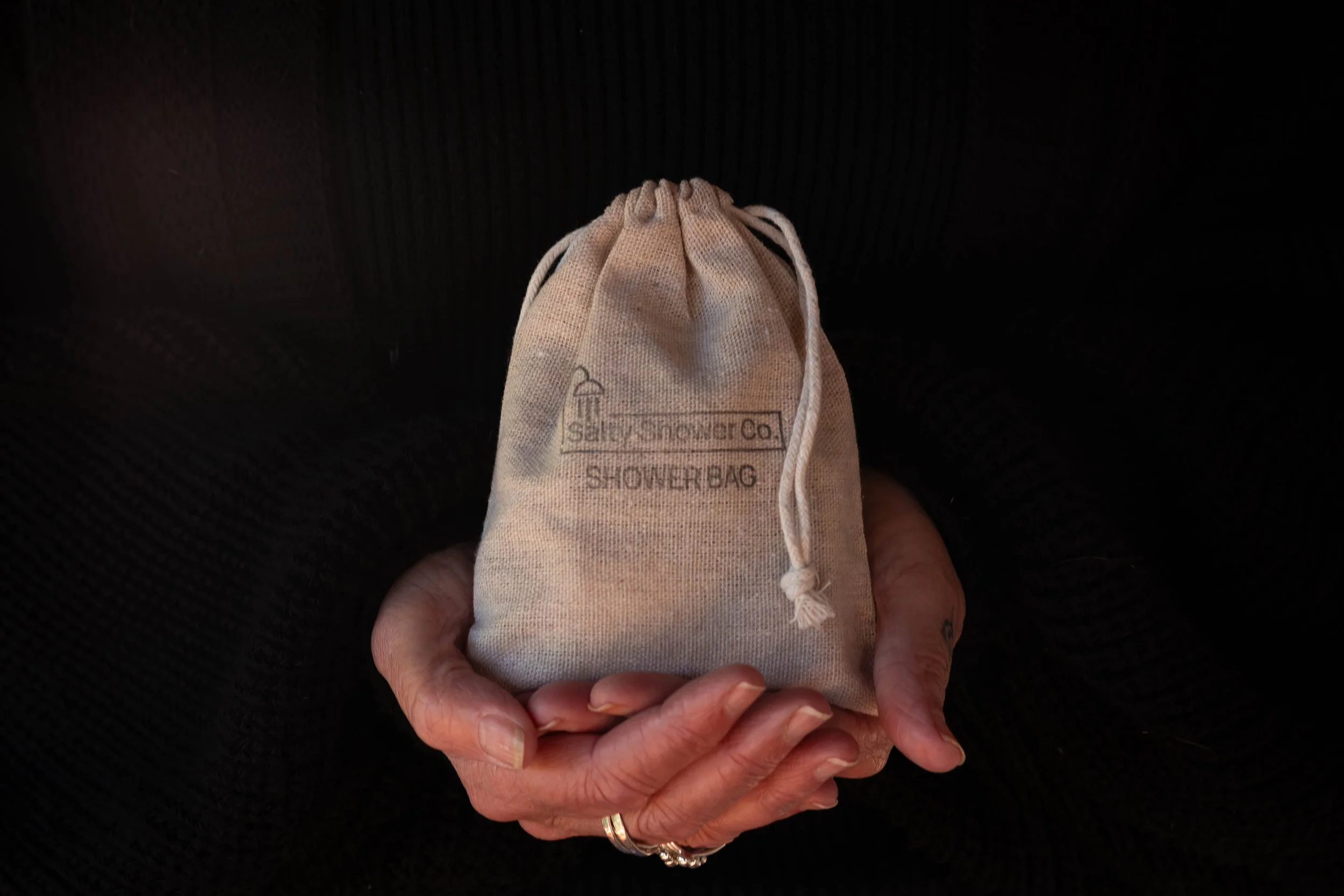HOLDING A Shower Bag.jpg