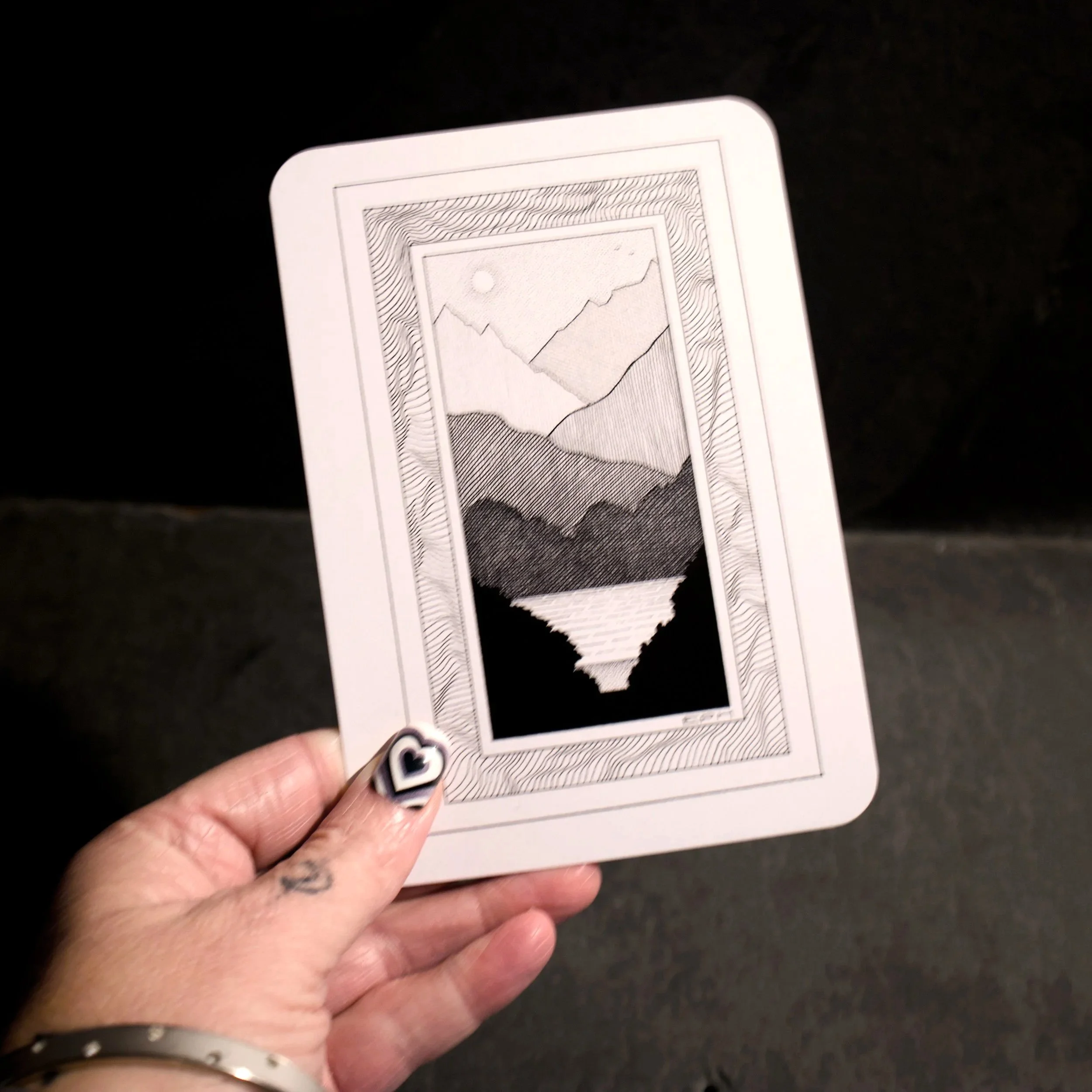 My dad's doodle 1. An intricate black and white illustration of an imagined landscape looking towards a lake, set in an abstract frame - Salty Note