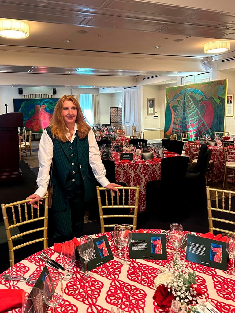 artist-maria-dubin-at-the university-club-washington-dc-lecture-hall-with-her-paintings-on-display