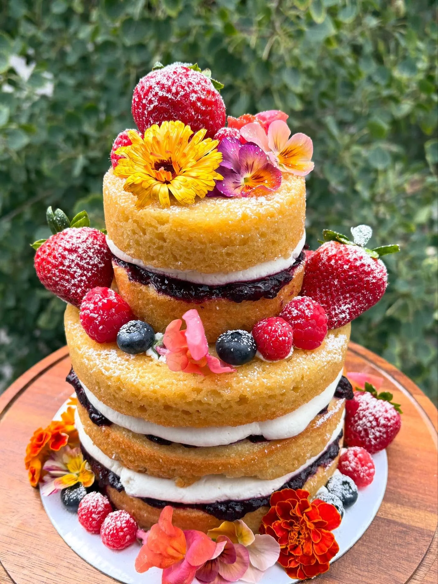 The most beautiful fairy wedding featuring a two tiered triple berry cake and individual mini cakes for their guests🧚&zwj;♀️✨