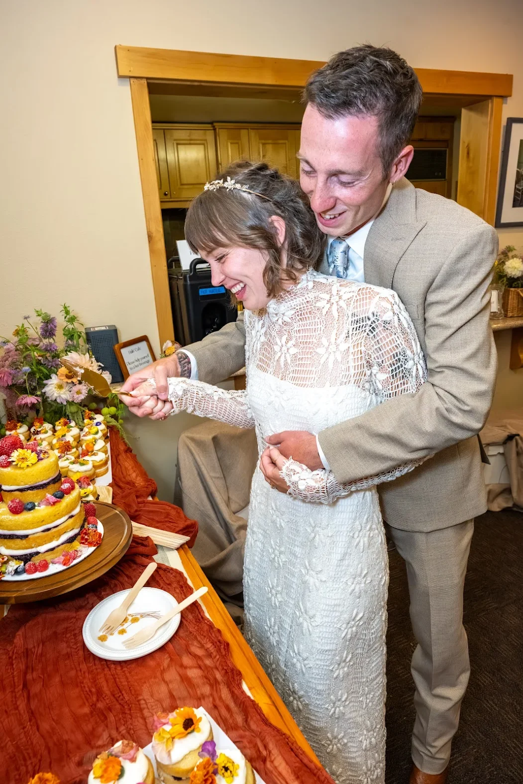 Couple in Mammoth Lakes doing the cake cutting at their wedding