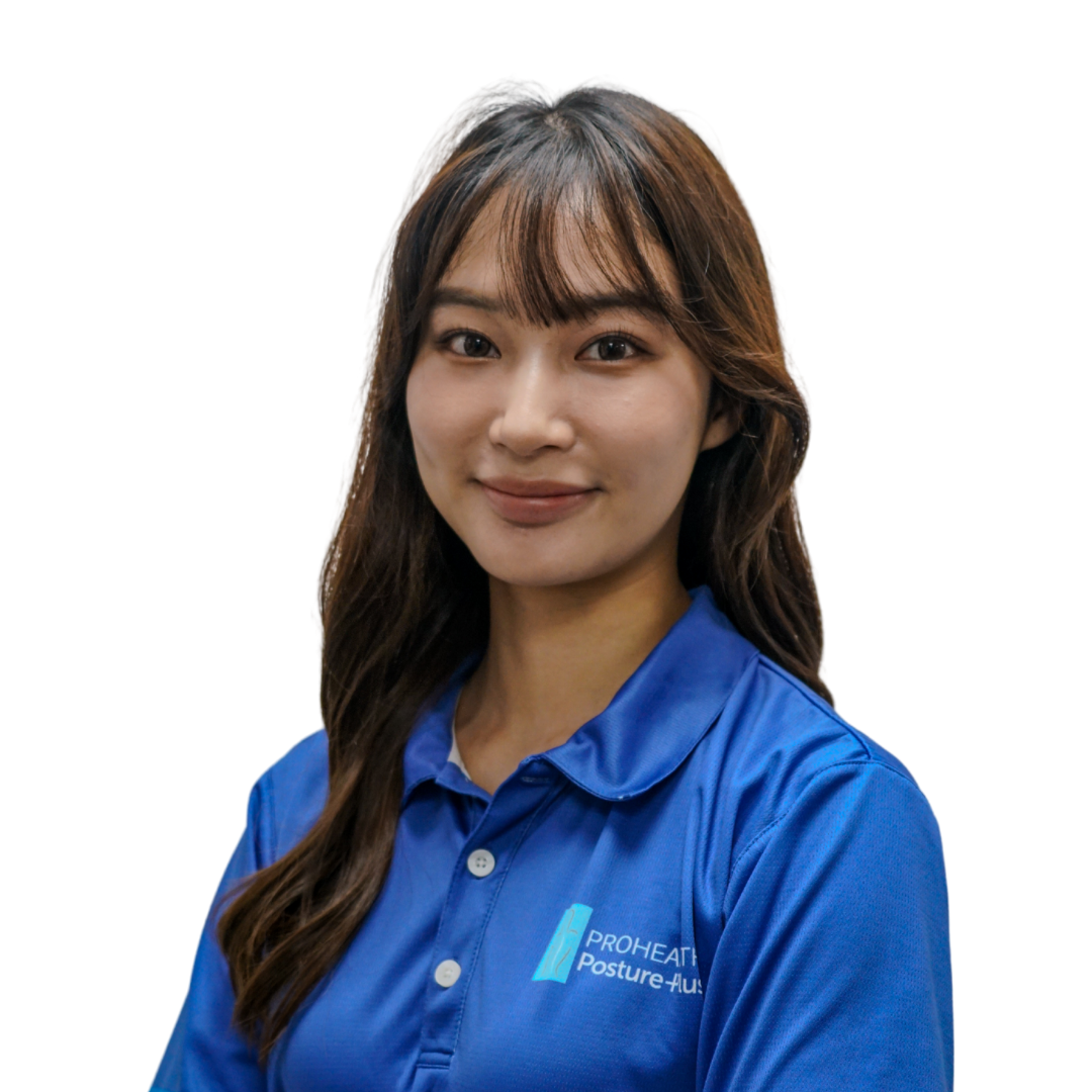 A woman with long brown hair in a blue polo shirt with a logo that says 'PROHEALTH Posture + Balance'
