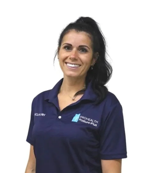 Person wearing a navy polo shirt with a logo and name embroidery, smiling, with a white background.