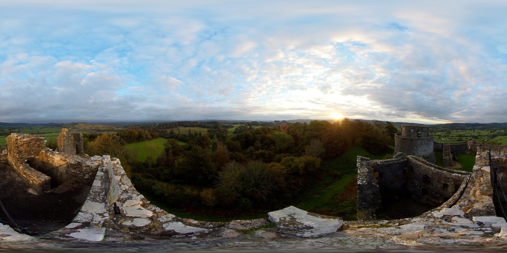 A dramatic landscape, countryside, trees, stone, both ancient and traditional, alive, ready to be explored.
