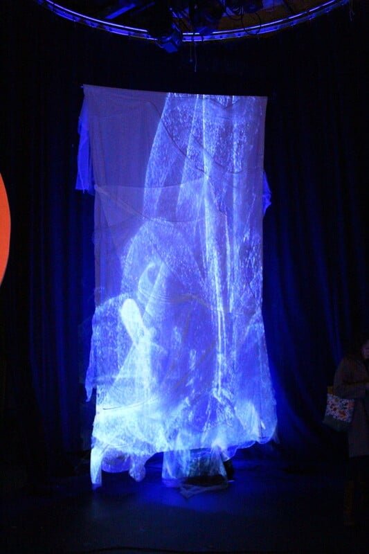 A watery projection, it moves and sways in motion, drawing us into feelings of longing and separation.