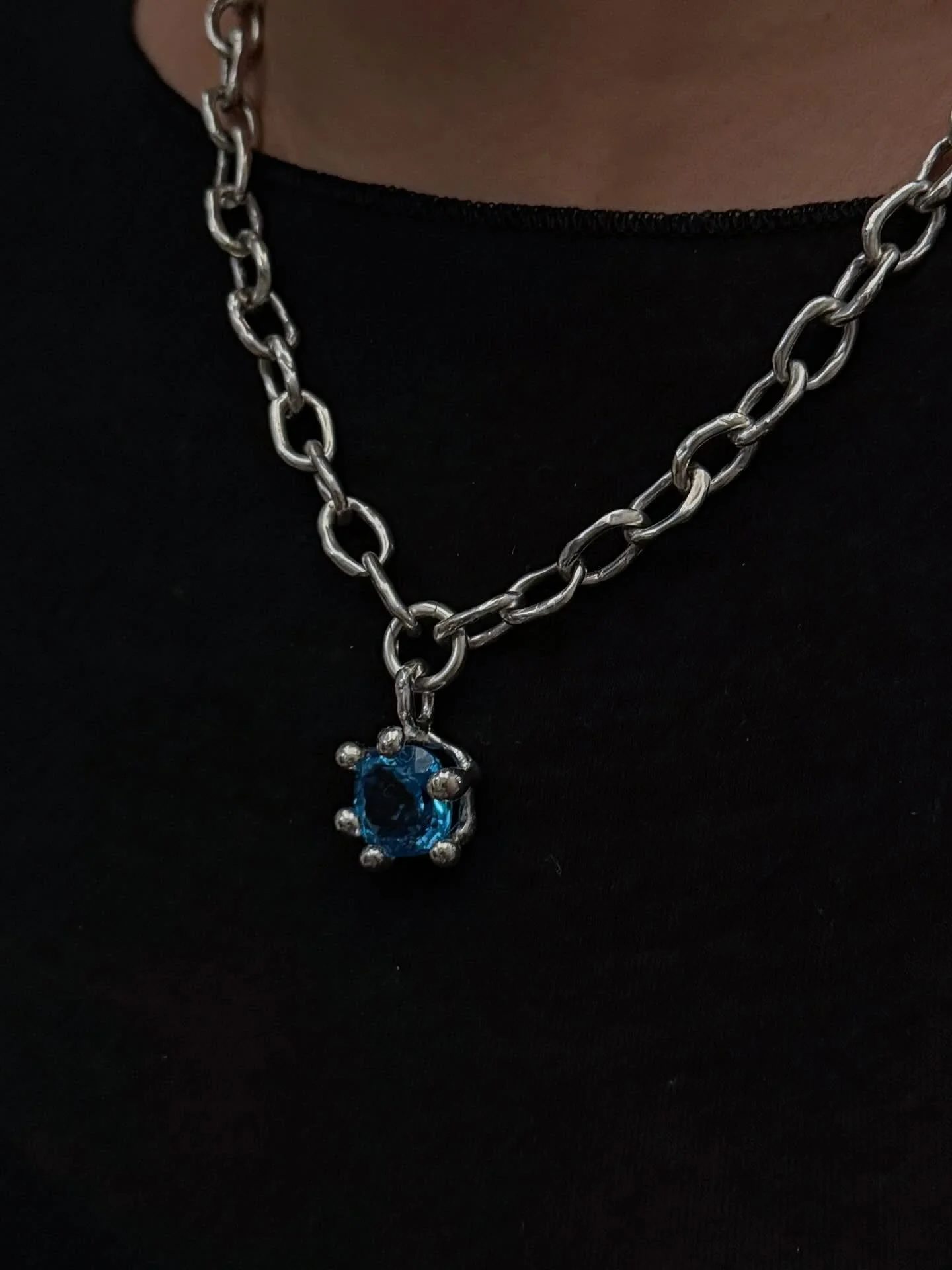 Custom made silver chain and topaz setting.

This piece was thoughtfully created for a very special occasion.