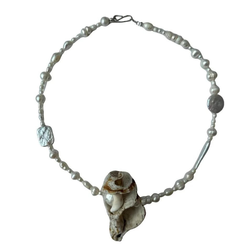 Pearl necklace with a large shell pendant