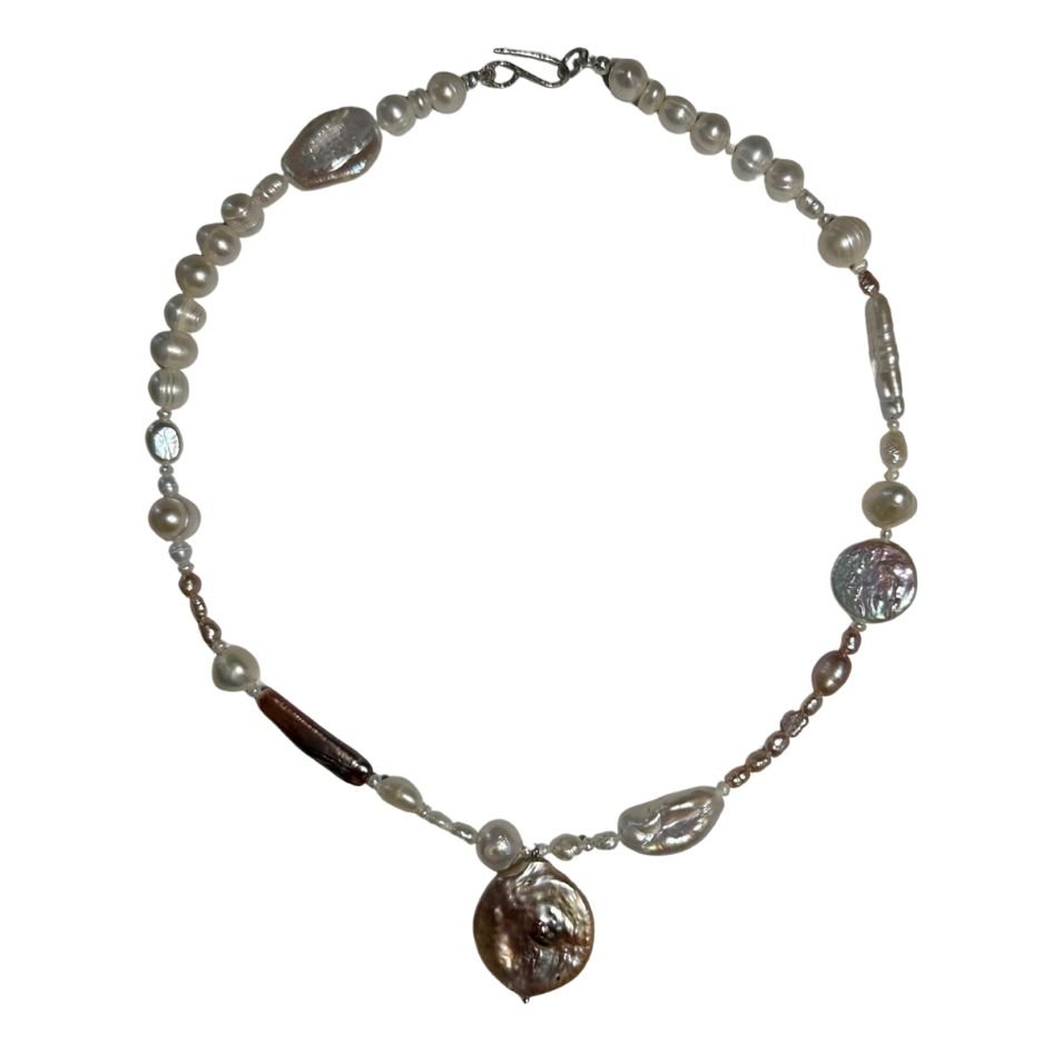Pearl necklace with various shaped pearls and beads, including a large irregular pearl pendant.