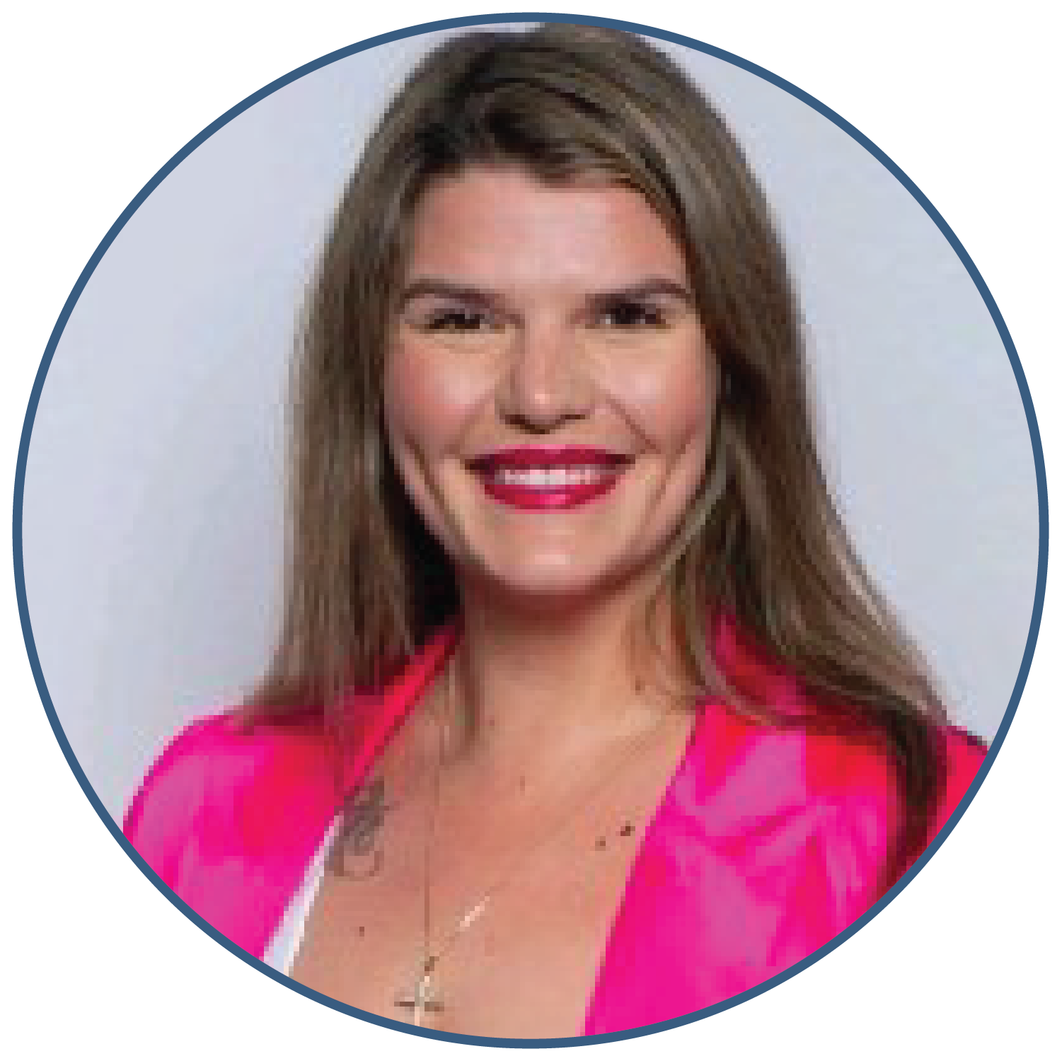 Smiling woman with long hair wearing a pink jacket
