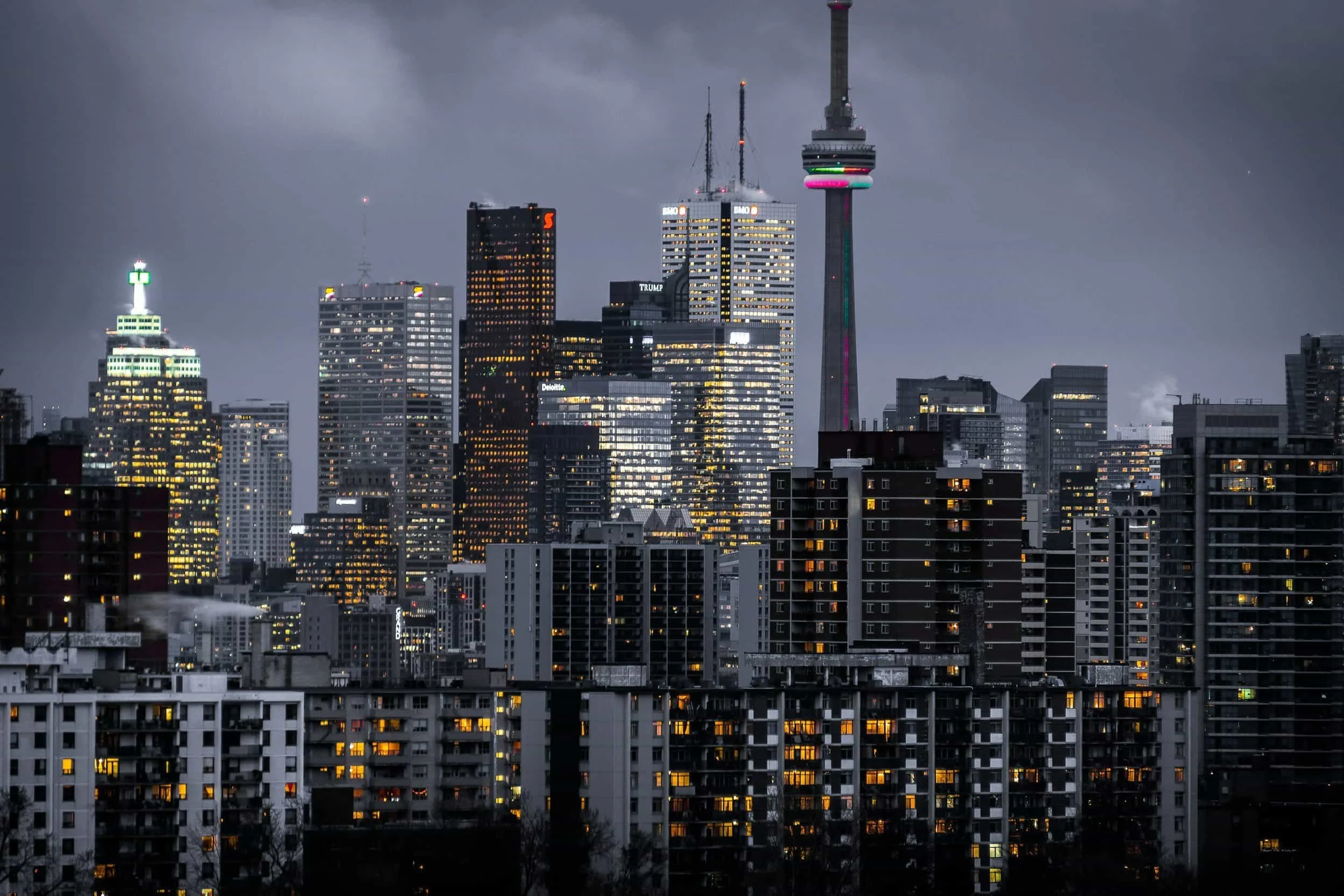 Toronto skyline at dusk with the CN Tower glowing, reflecting a city vibrant with toronto conversion focused web design energy.