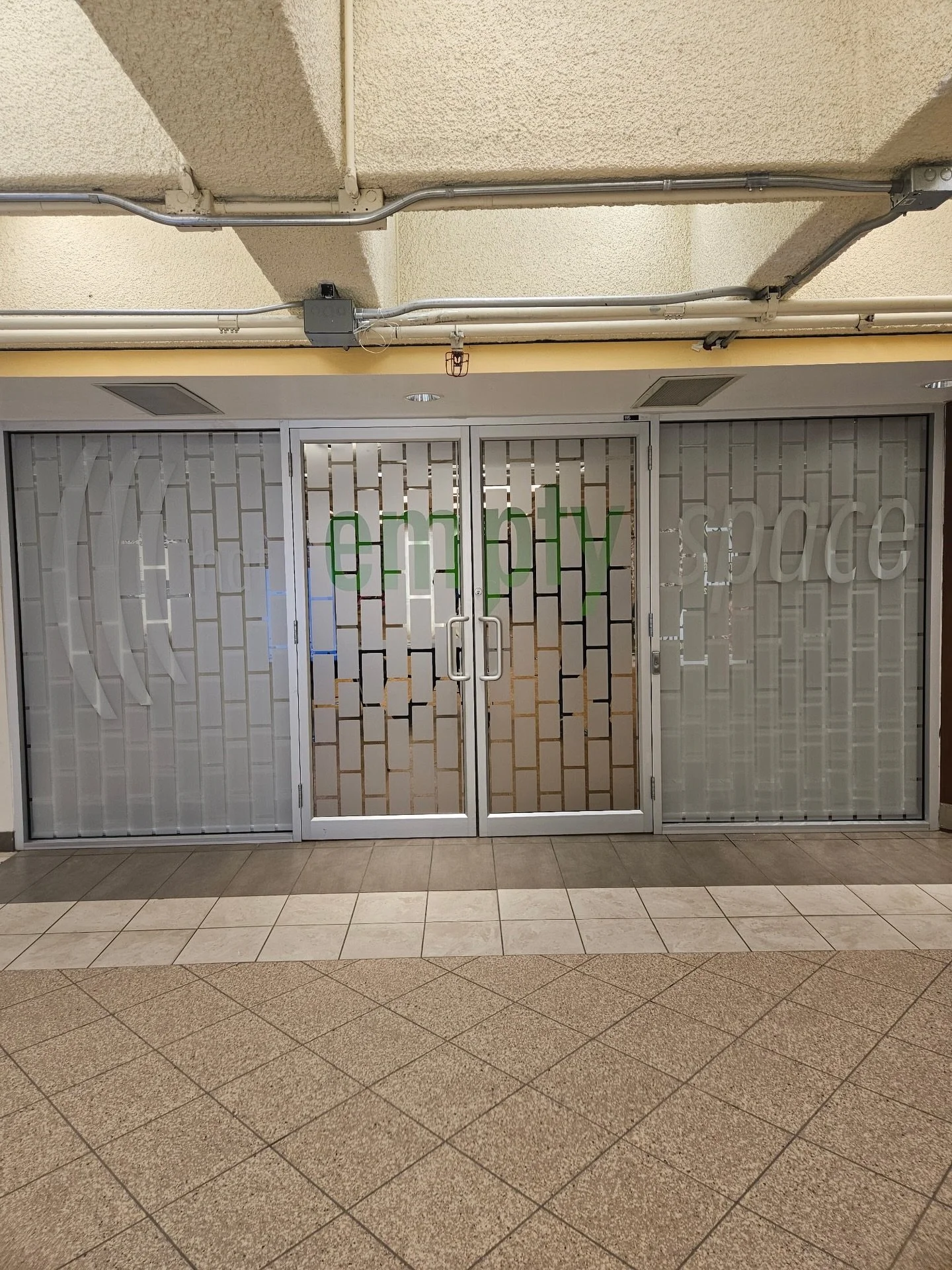 A clean, modern storefront achieved with custom patterned privacy film and precision cut graphics from etched vinyl.

Window films are a simple but impactful way to introduce branding, add privacy, and elevate a commercial space. 

Produced and insta