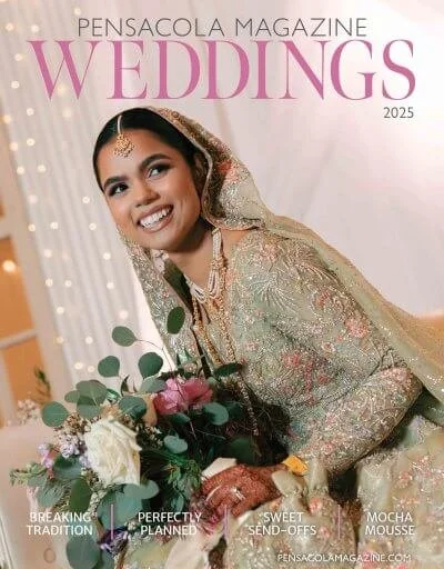 Cover of Pensacola Magazine Weddings 2025 featuring a smiling bride in a traditional wedding dress with a veil, holding a bouquet of flowers, standing indoors with decorative lighting.