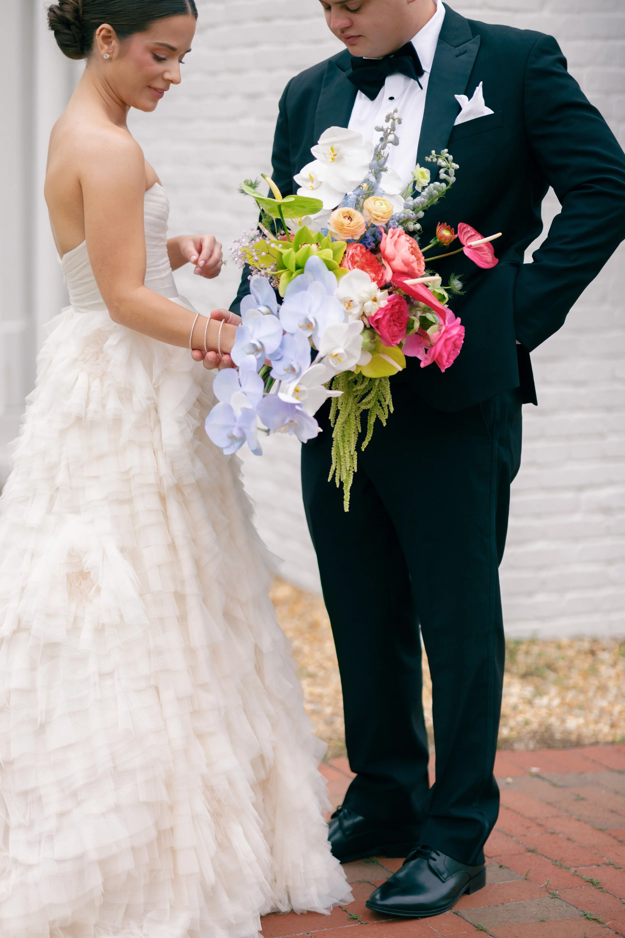 Bride and groom exchanging flowers during a wedding ceremony.