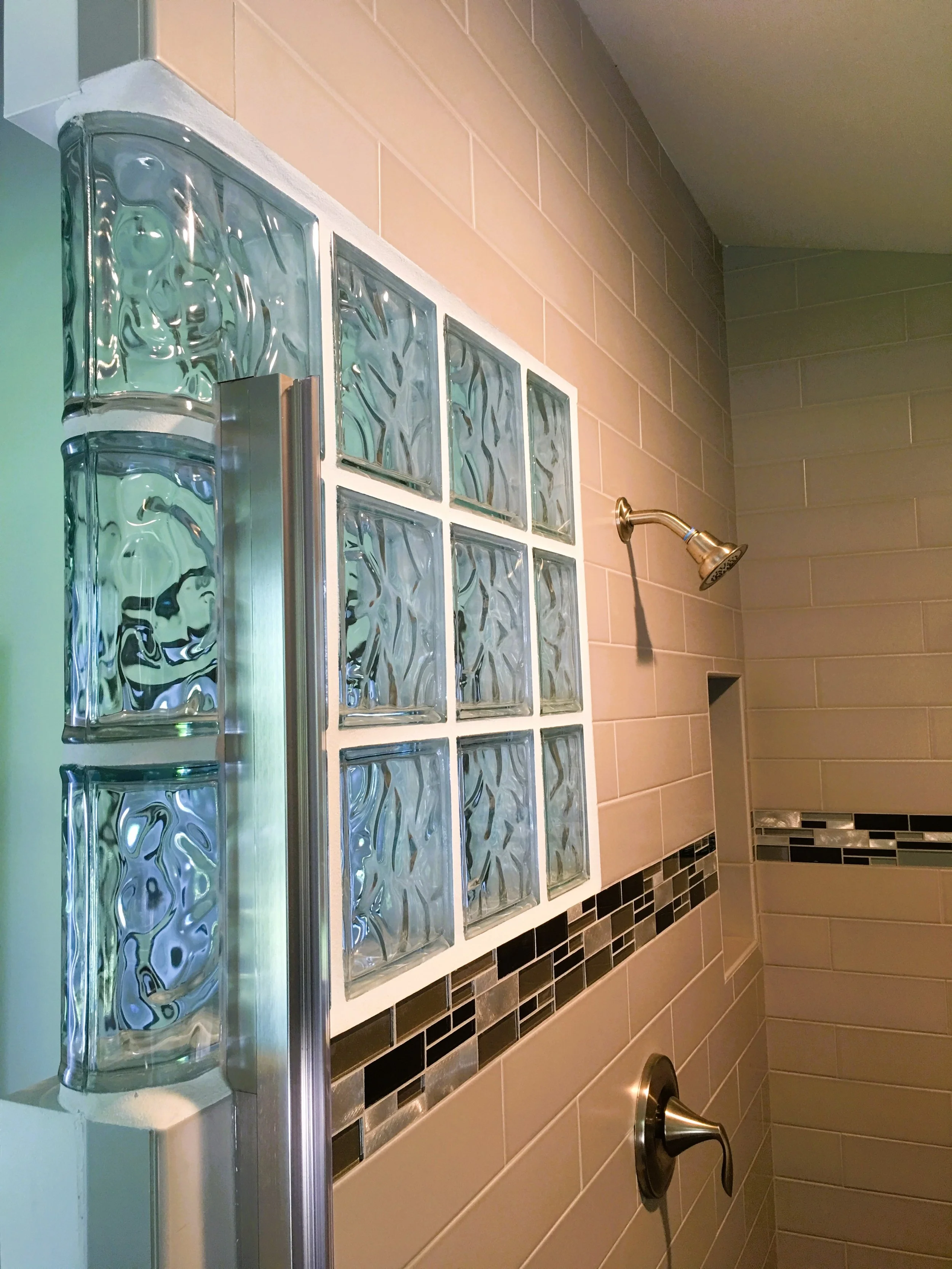 Beige tile shower with glass block and detail tile.JPG