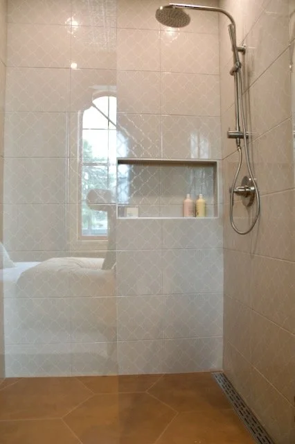 White tile shower with double niche