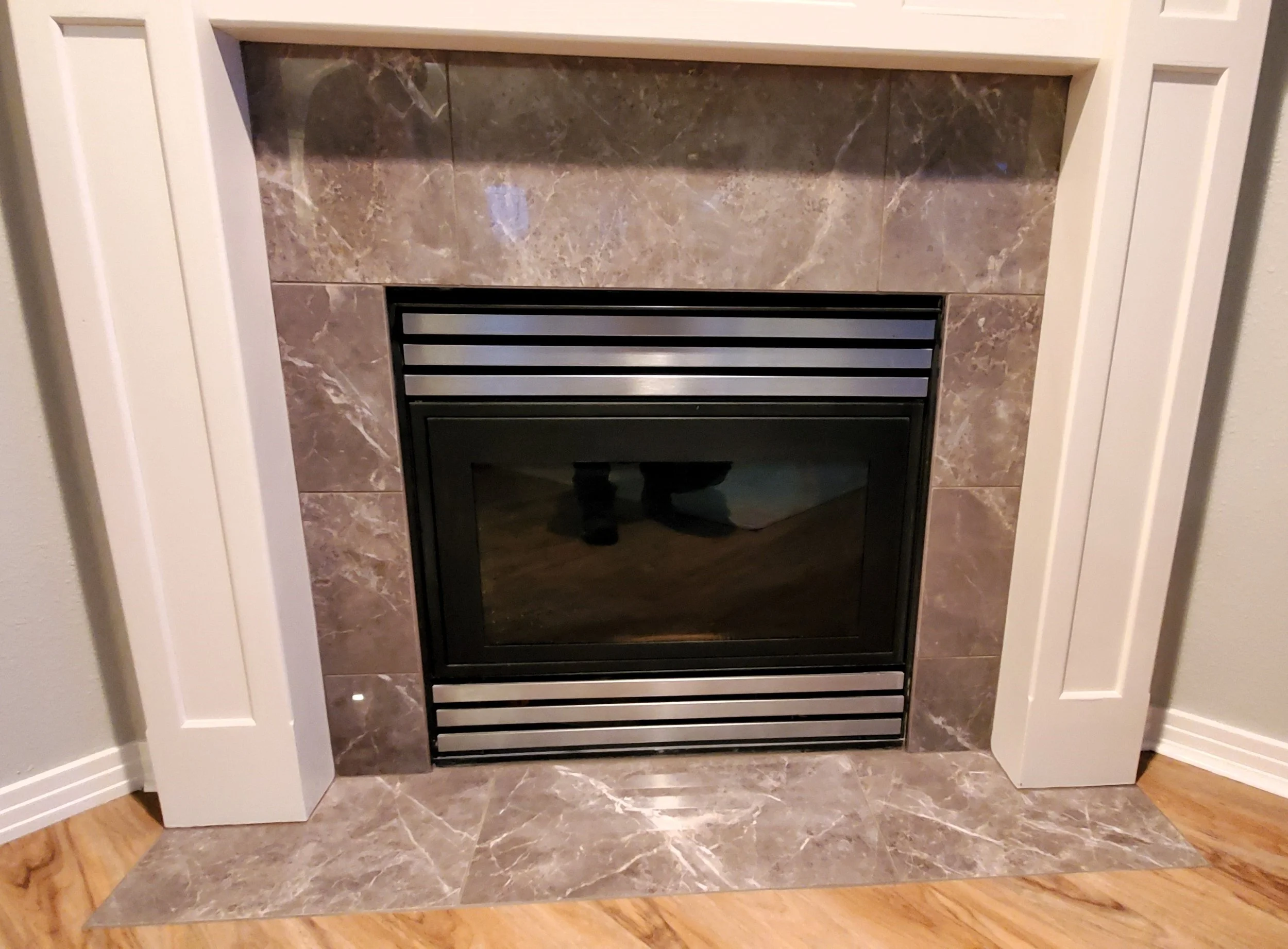 Brown marble tile fireplace