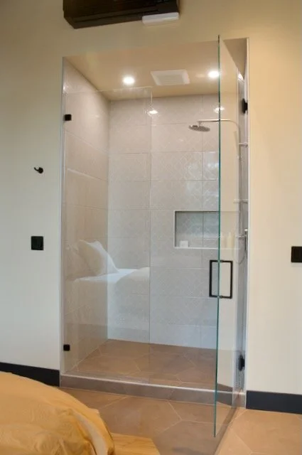 White tile shower with double niche