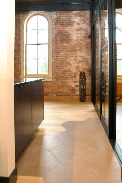 Hexagon brown tile floor blend in with wood floors