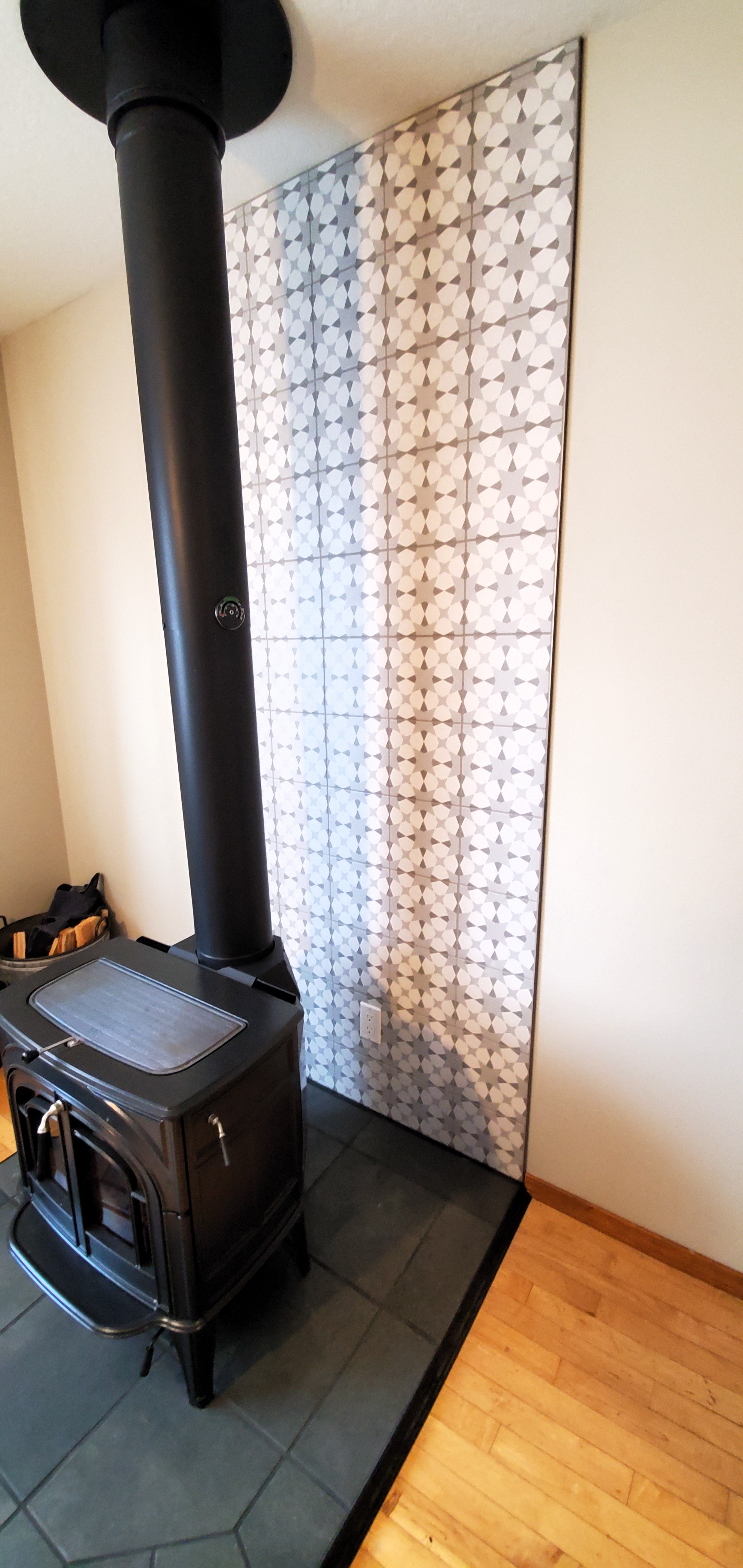 Black hearth tile with brown and white tile fireplace