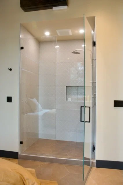 White tile shower with double niche