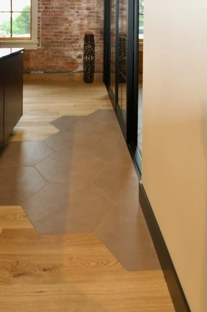Hexagon brown tile floor blend in with wood floors