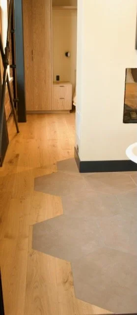 Hexagon brown tile floor blend in with wood floors