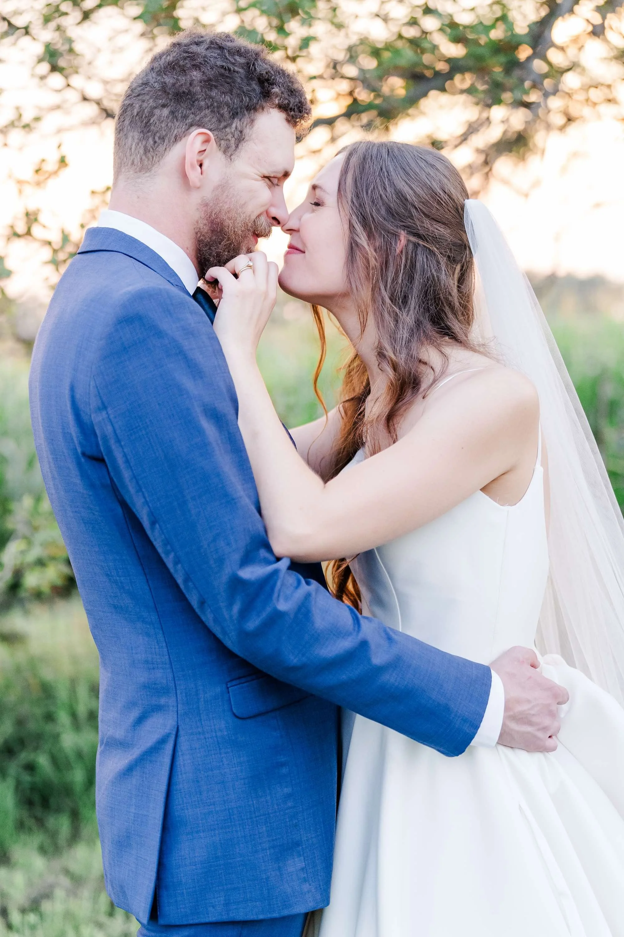 bride and groom touching noses