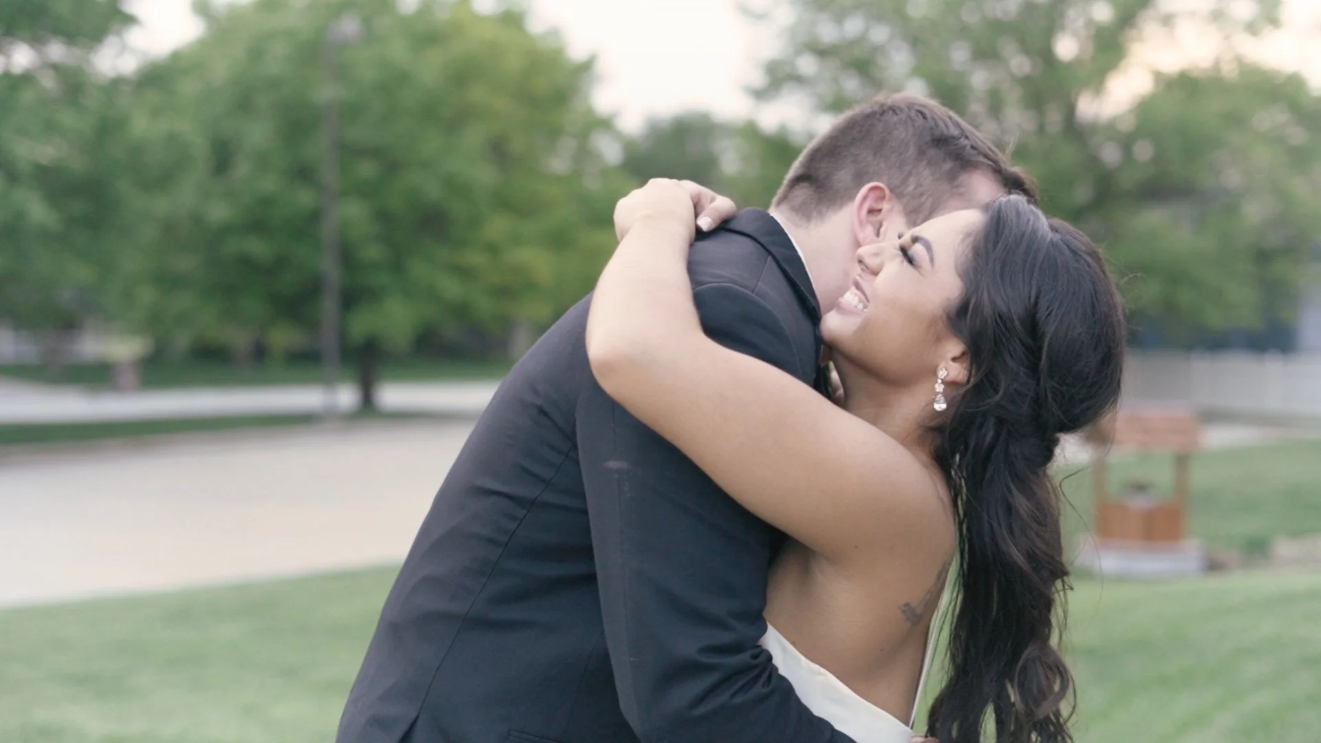 bride and groom hugging on their wedding day